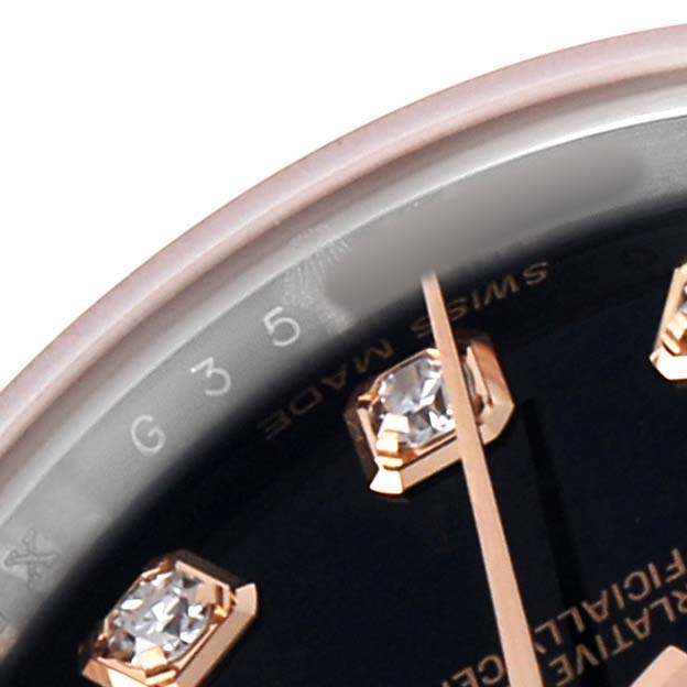 The image shows a close-up of the Rolex Datejust 179171 Women's Steel and Gold (two tone) Black Dial's dial with diamond hour markers, a segment of the bezel, and the "Swiss Made" text.
