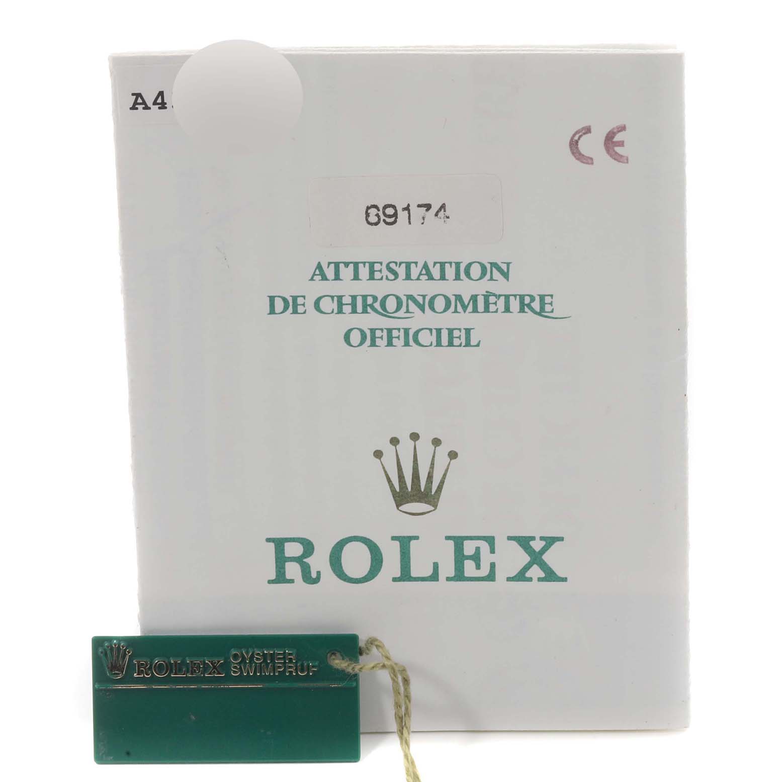 The image shows an official Rolex certificate for the Datejust model, alongside a green Rolex tag.