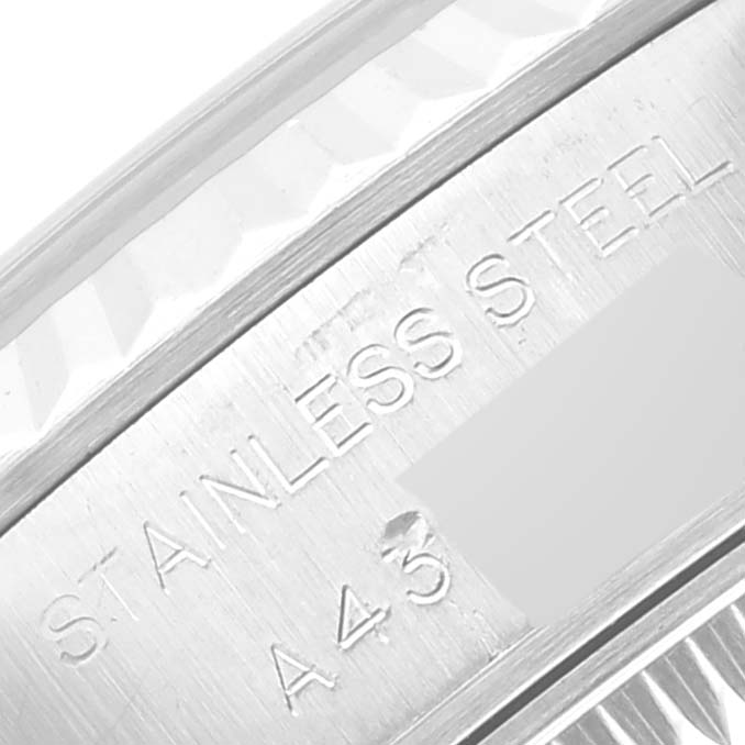 The image shows a close-up of the stainless steel engravings on the Rolex Datejust 69174 Women's Stainless Steel Black Dial 69174 Women's Stainless Steel Black Dial watch's case back.