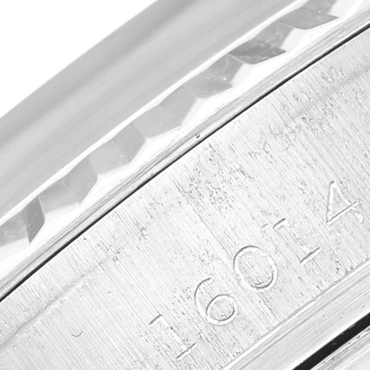 This image shows a close-up of the model number engraving and part of the bezel of the Rolex Vintage Collection 16014 Men's Stainless Steel Silver Dial 16014 Men's Stainless Steel Silver Dial watch.