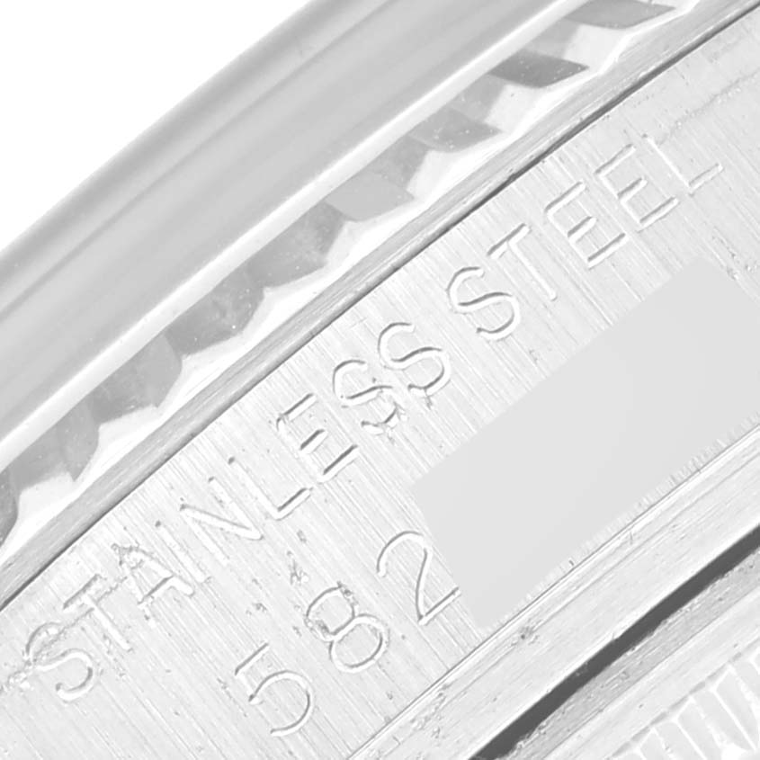 This image shows a close-up of the side engraving on the stainless steel casing of a Rolex Vintage Collection 16014 Men's Stainless Steel Silver Dial 16014 Men's Stainless Steel Silver Dial watch.