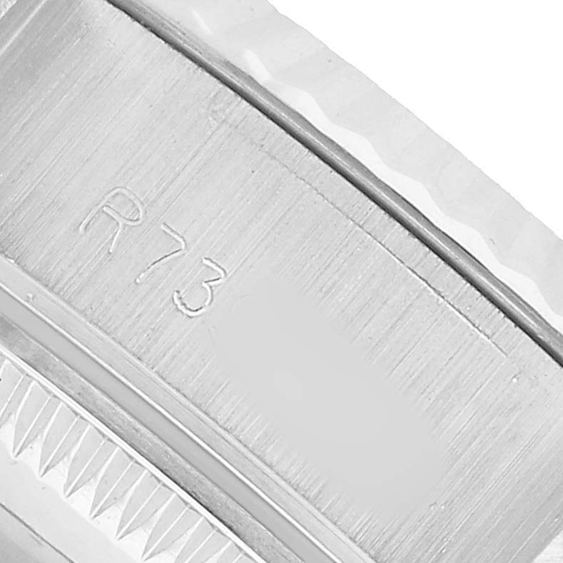 The image shows a close-up of the engraved inner bezel (rehaut) of a Rolex Datejust 69174 Women's Stainless Steel Silver Dial watch.