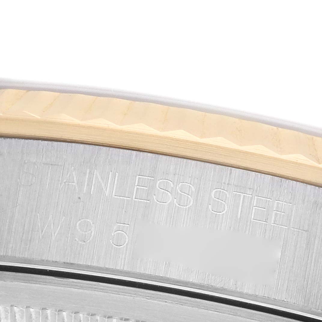 This image shows a close-up of the Rolex Datejust 16233 Men's Steel and Gold (two tone) Grey Dial watch's stainless steel case side and bezel.