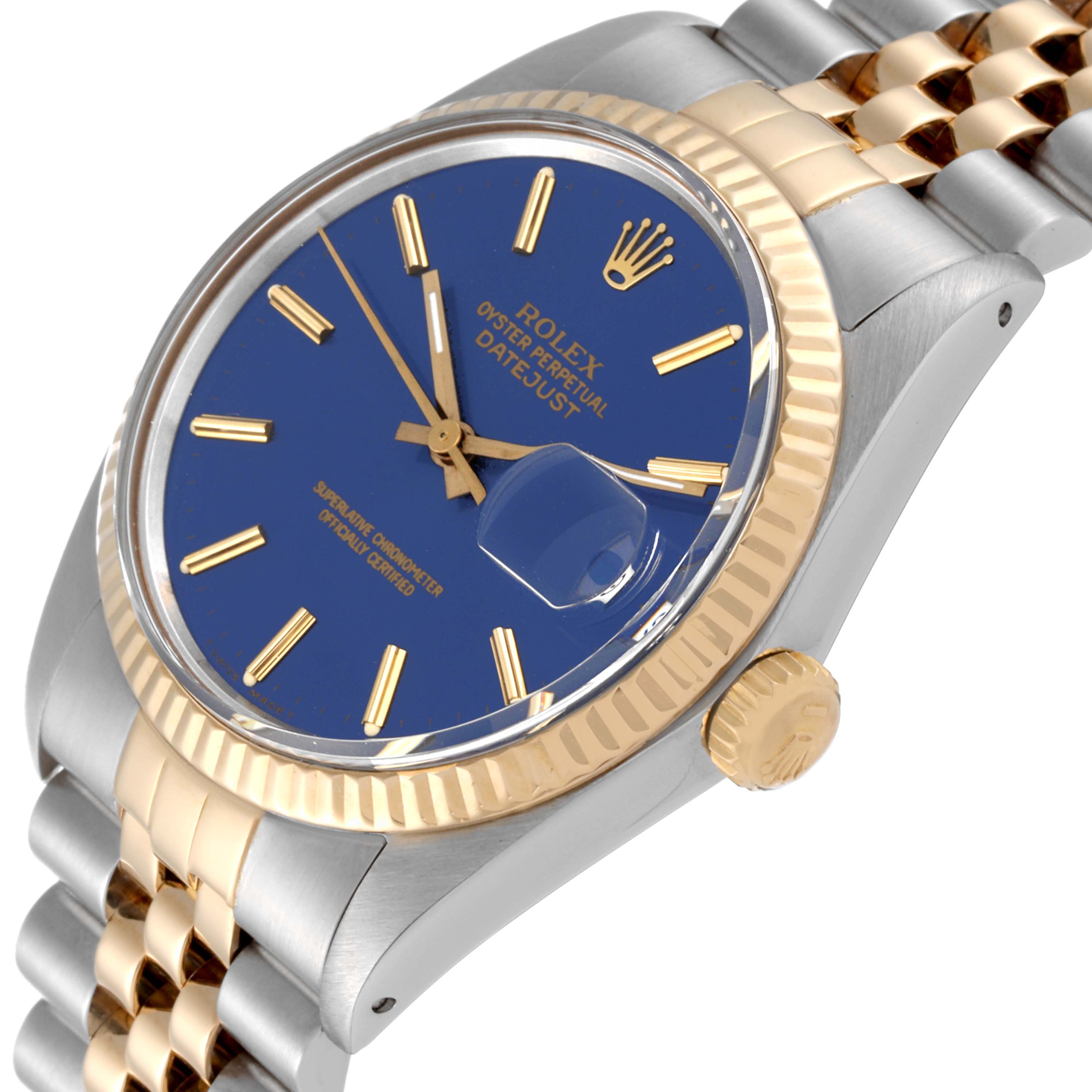 The image shows an angled view of the Rolex Vintage Collection 16013 Men's Steel and Gold (two tone) Blue Dial 16013 Men's Steel and Gold (two tone) Blue Dial Datejust watch, highlighting its blue dial, fluted bezel, and jubilee bracelet.