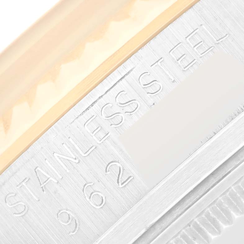 This close-up image shows the case, bezel, and part of the engraved text of the Vintage Collection model by Rolex.