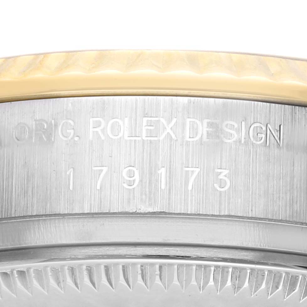 The image shows the side of a Rolex Datejust 179173 Women's Steel and Gold (two tone) Blue Dial 179173 Women's Steel and Gold (two tone) Blue Dial, highlighting the model number and part of the bezel.