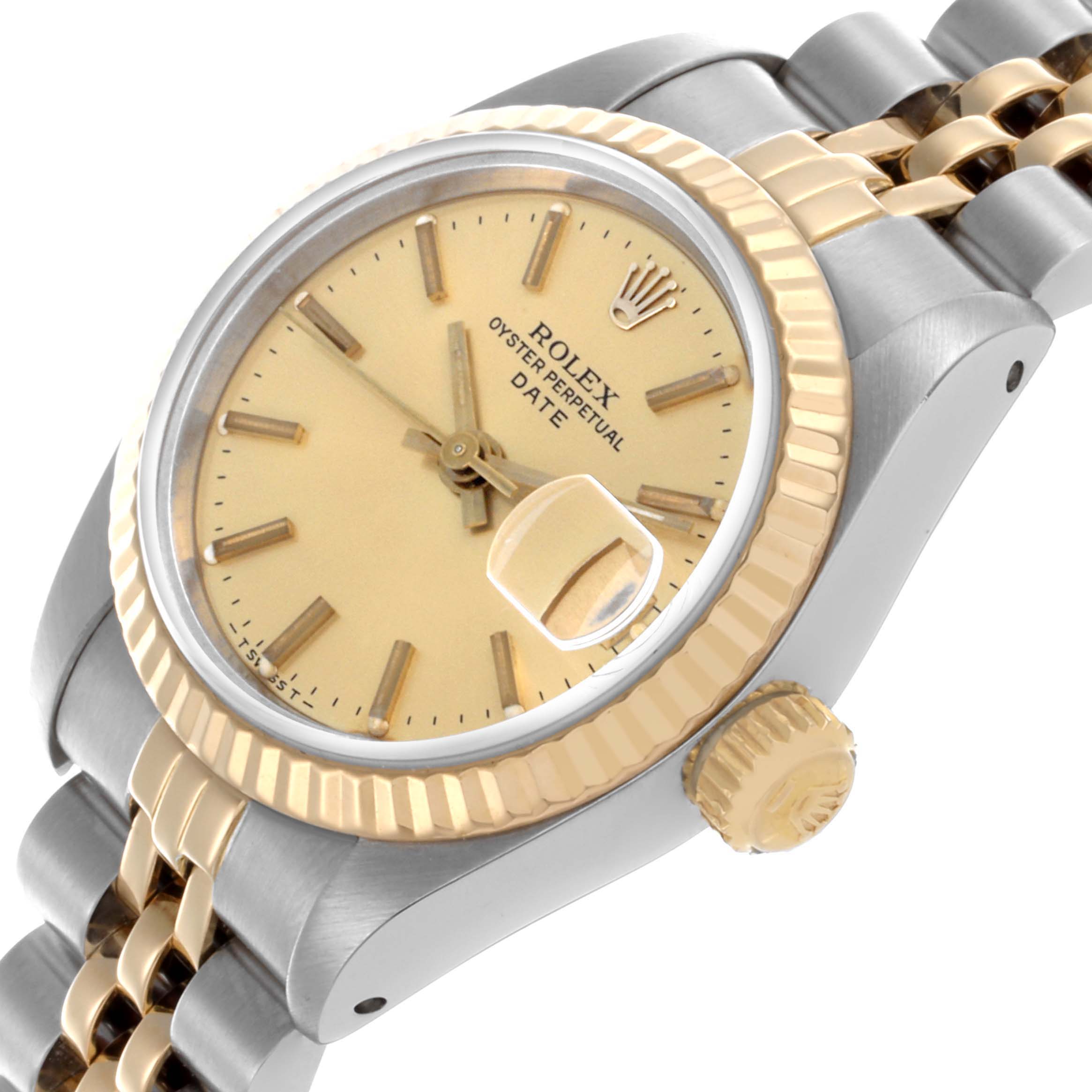 The image shows a Rolex Date 69173 Women's Steel and Gold (two tone) Champagne Dial 69173 Women's Steel and Gold (two tone) Champagne Dial model watch at an angled view, highlighting the dial, crown, fluted bezel, and jubilee bracelet.