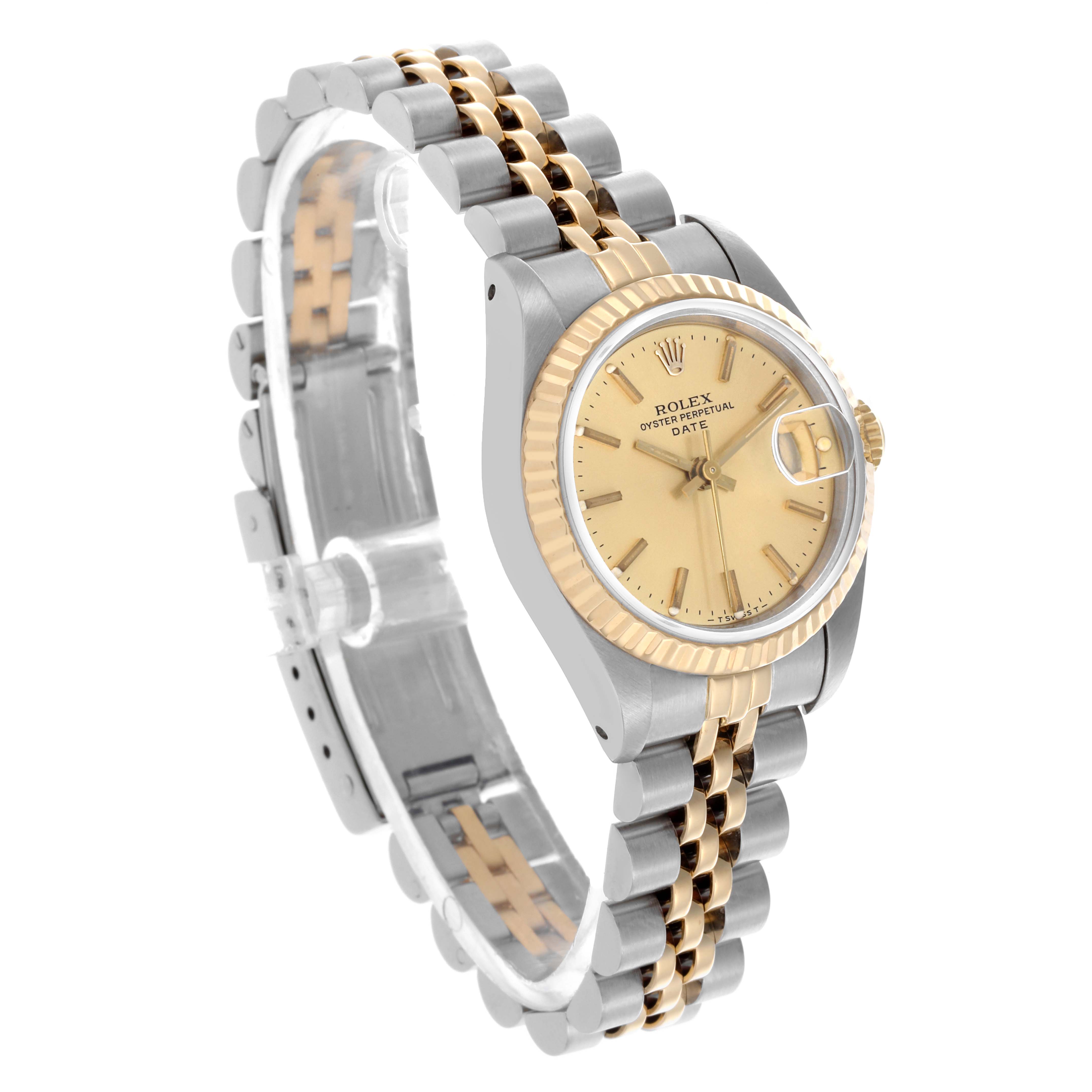 The Rolex Date 69173 Women's Steel and Gold (two tone) Champagne Dial 69173 Women's Steel and Gold (two tone) Champagne Dial watch is shown from an angled side view, highlighting its face, bezel, and two-tone bracelet.