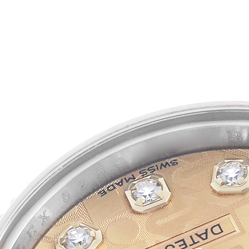 The image shows a close-up of the bezel and dial edge of a Rolex Datejust 179173 Women's Steel and Gold (two tone) Champagne Dial, highlighting diamond markers and engravings.