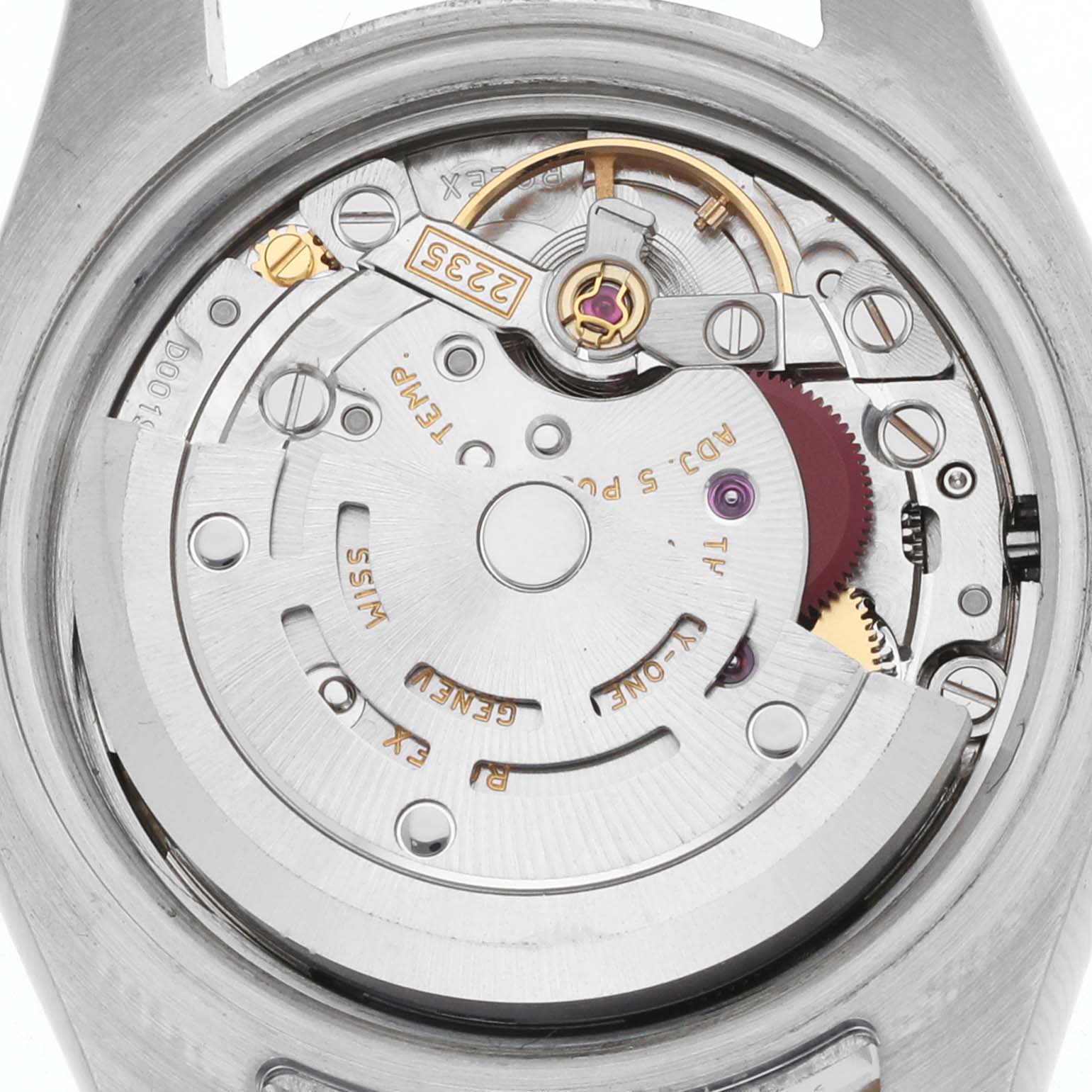 The image shows the movement mechanism of a Rolex Datejust 179173 Women's Steel and Gold (two tone) Champagne Dial, viewed from the back with its intricate components visible.