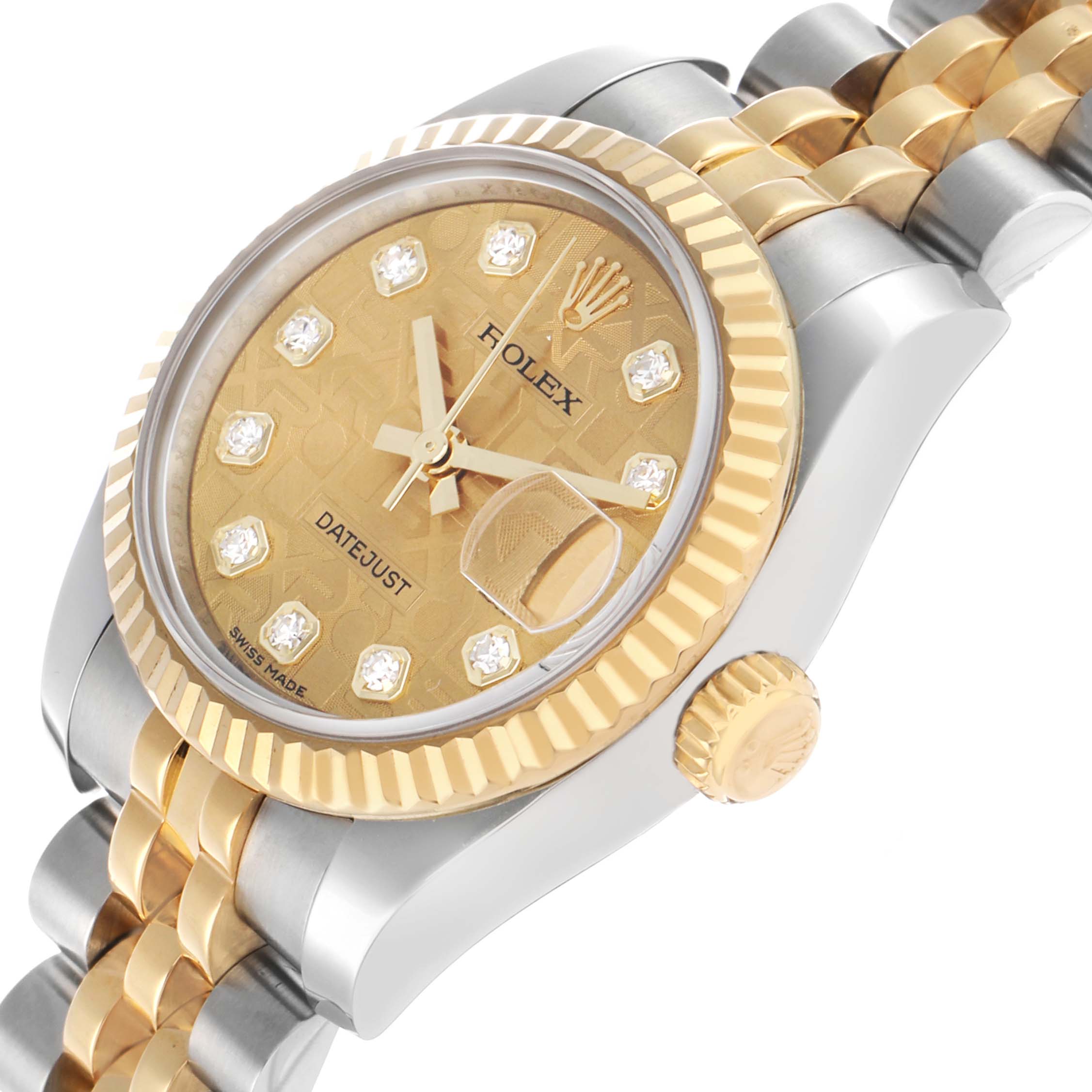 The Rolex Datejust 179173 Women's Steel and Gold (two tone) Champagne Dial watch is shown at a tilted angle, highlighting the dial, bezel, crown, and part of the bracelet.