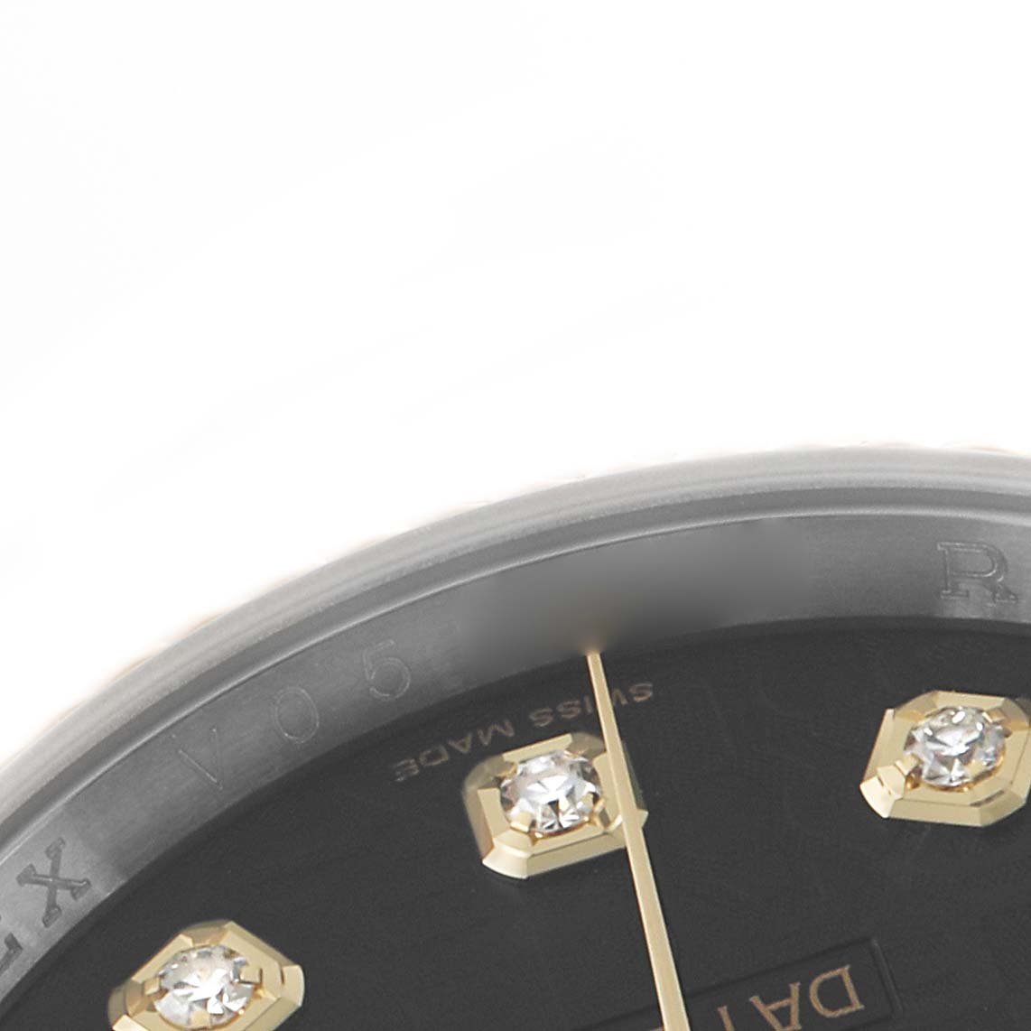 The image shows a close-up of the Datejust watch face by Rolex, highlighting the bezel, part of the dial, and diamond markers.