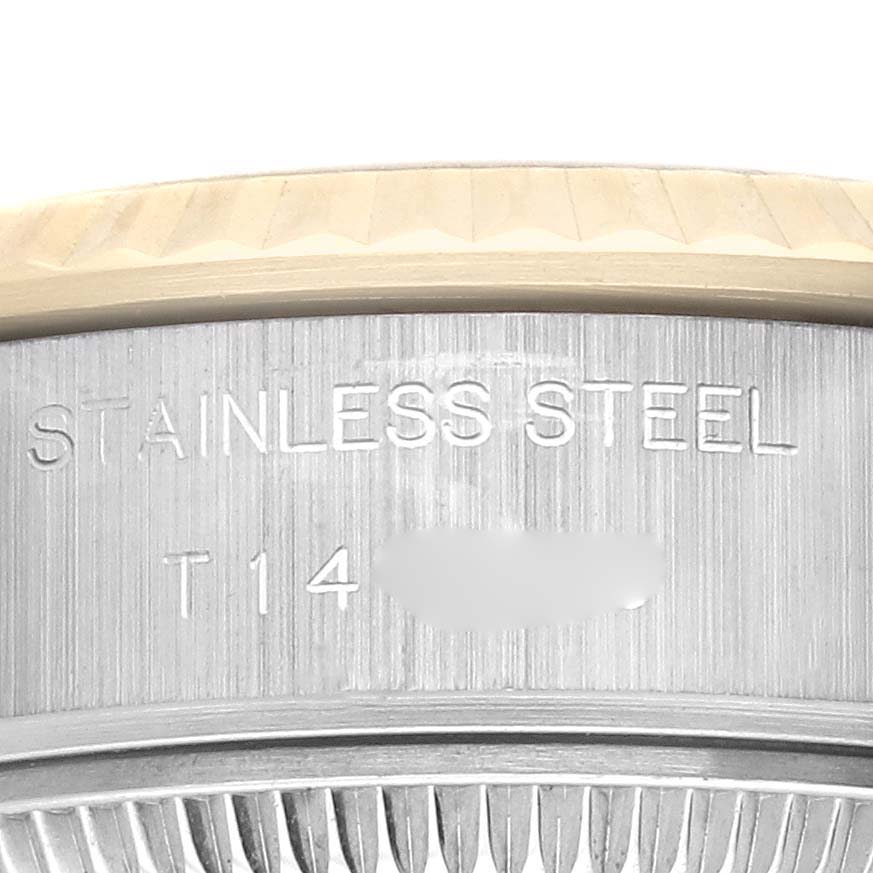 The image shows a close-up of the case back edge of a Rolex Datejust 69173 Women's Steel and Gold (two tone) Champagne Dial 69173 Women's Steel and Gold (two tone) Champagne Dial, highlighting the "STAINLESS STEEL" engraving.
