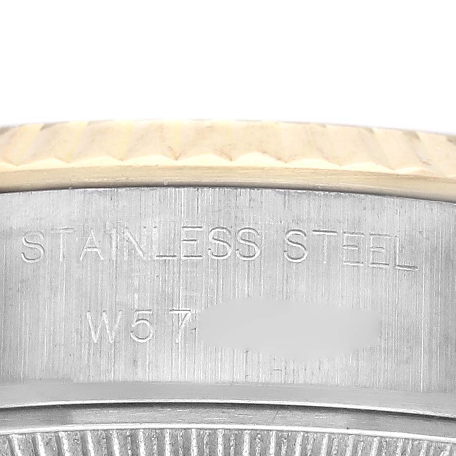 The image shows a close-up of the bezel and side case of the Rolex Datejust 69173 Women's Steel and Gold (two tone) Champagne Dial 69173 Women's Steel and Gold (two tone) Champagne Dial, highlighting the "Stainless Steel" engraving.