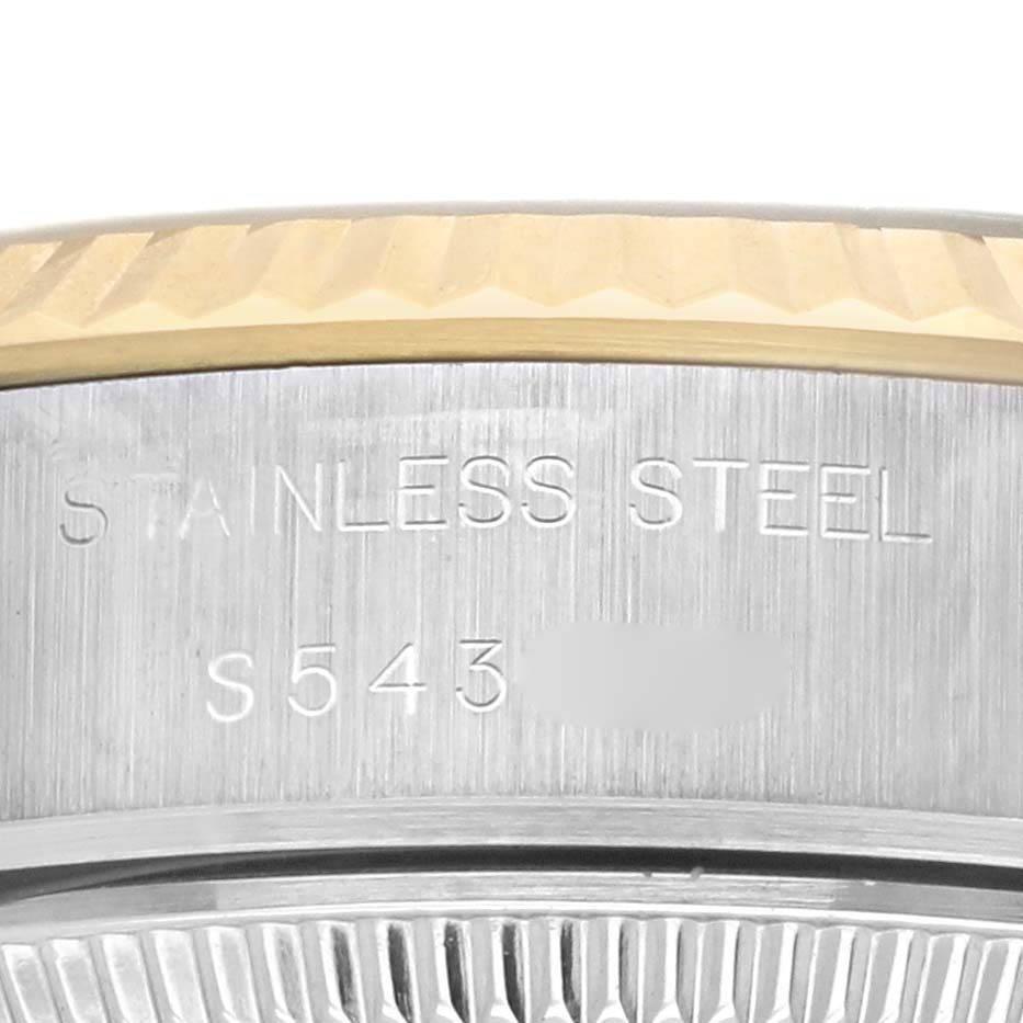 The image shows a close-up of the stainless steel case back and gold fluted bezel of a Rolex Datejust 69173 Women's Steel and Gold (two tone) Champagne Dial 69173 Women's Steel and Gold (two tone) Champagne Dial watch.