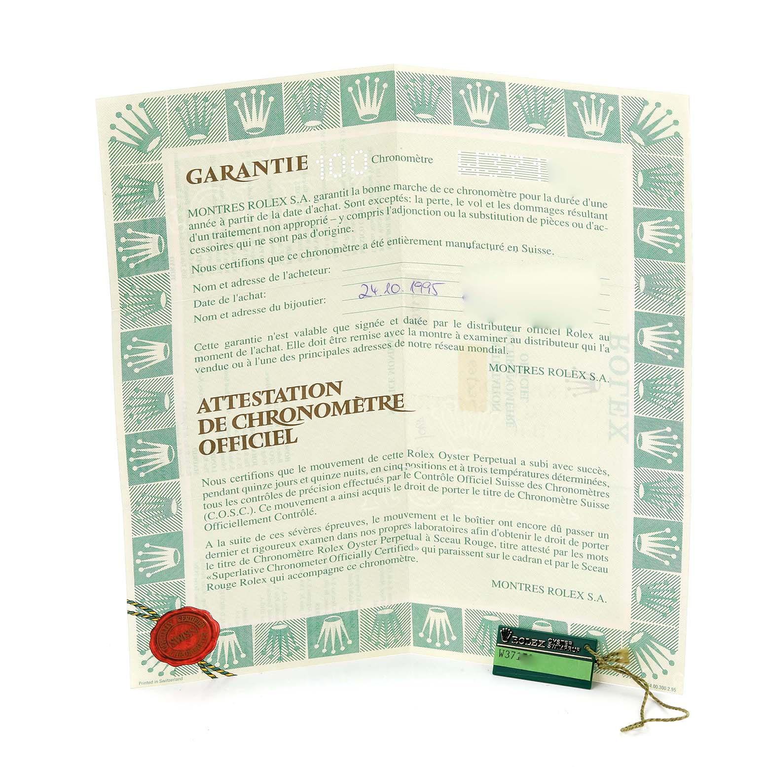 The image shows a Rolex Datejust 69173 Women's Steel and Gold (two tone) Champagne Dial 69173 Women's Steel and Gold (two tone) Champagne Dial warranty certificate and a green hang tag displayed at an angle.