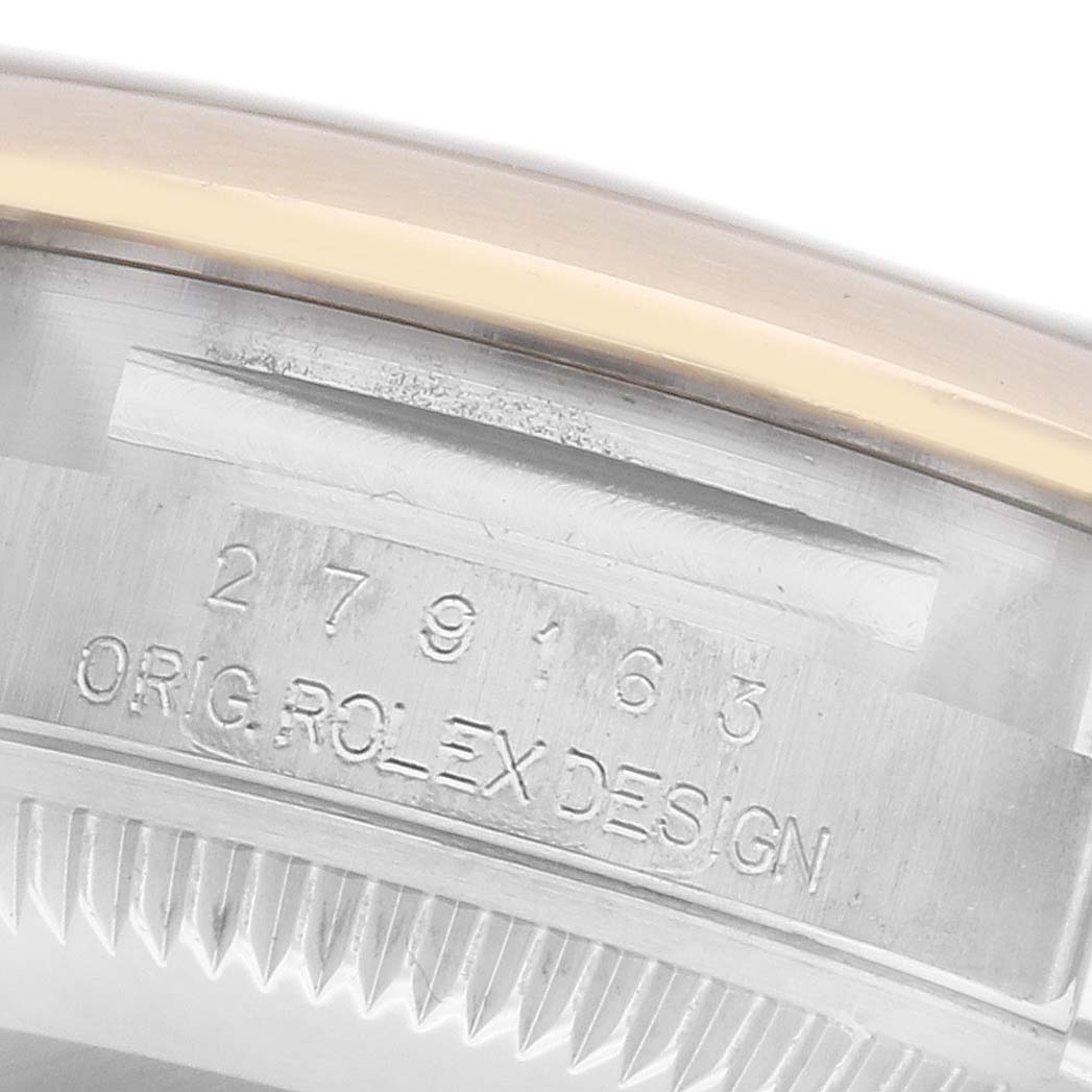The image shows a close-up of the watch's side, focusing on the engraved serial number and "ORIG ROLEX DESIGN" on the Rolex Datejust 279163 Women's Steel and Gold (two tone) Silver Dial model.