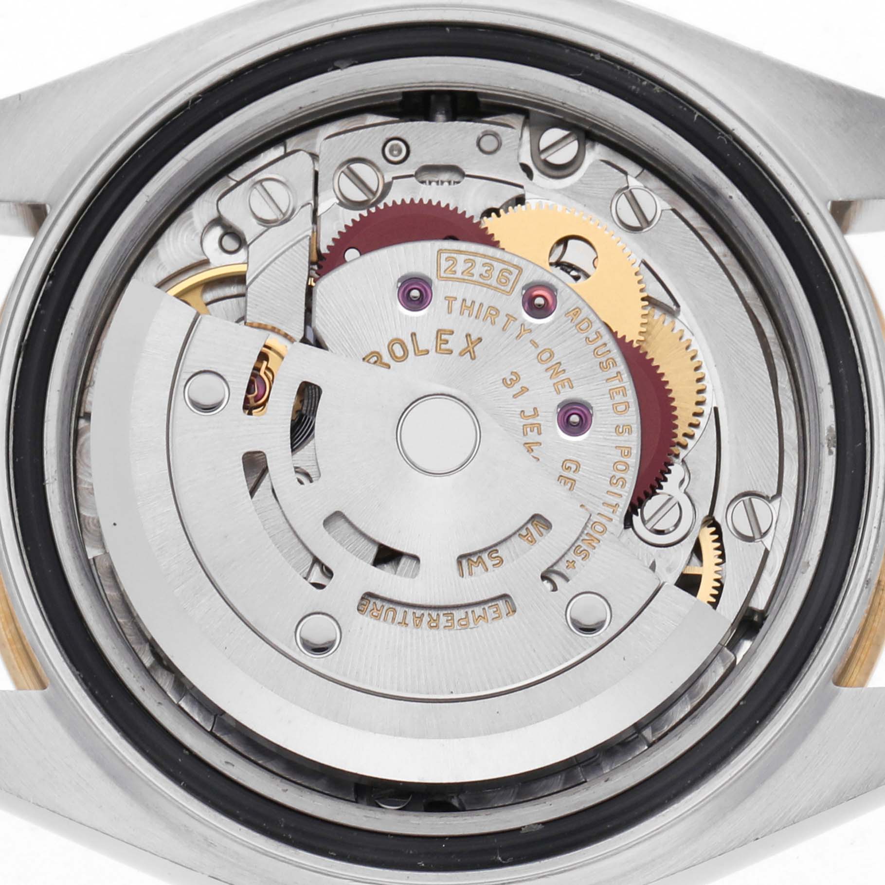 The image shows the back view of a Rolex Datejust 279163 Women's Steel and Gold (two tone) Silver Dial, focusing on its intricate movement and internal mechanisms.