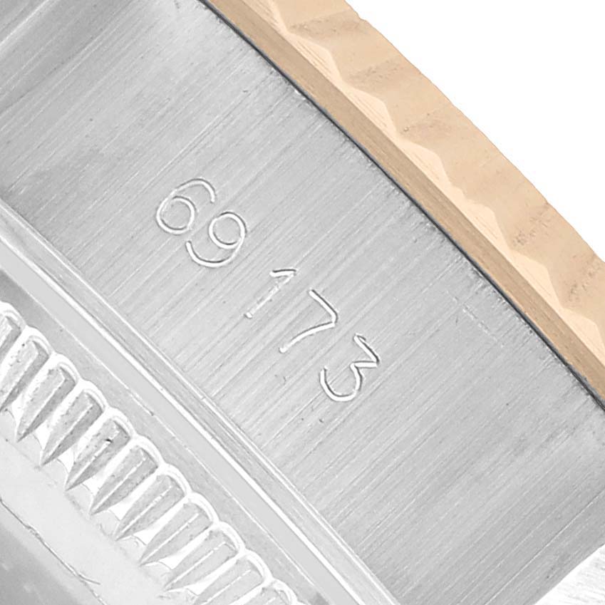 The image shows a close-up of the model number engraved on a Datejust bezel by Rolex.