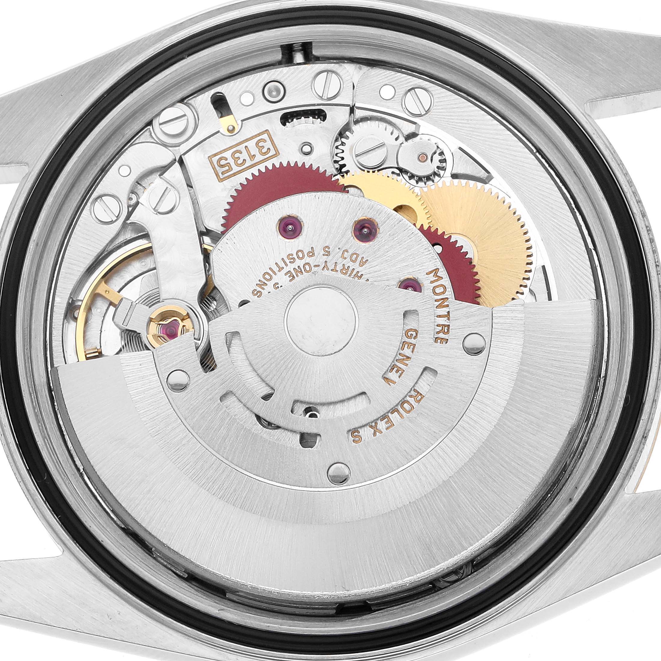 The image shows the movement of a Rolex Datejust 16233 Men's Steel and Gold (two tone) White Dial watch from a rear angle, highlighting the rotor and internal gears.