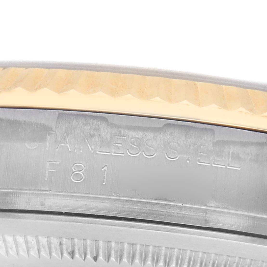 The image shows a close-up of the bezel and rehaut of a Rolex Datejust 116233 Men's Steel and Gold (two tone) White Dial, highlighting the materials and engravings.