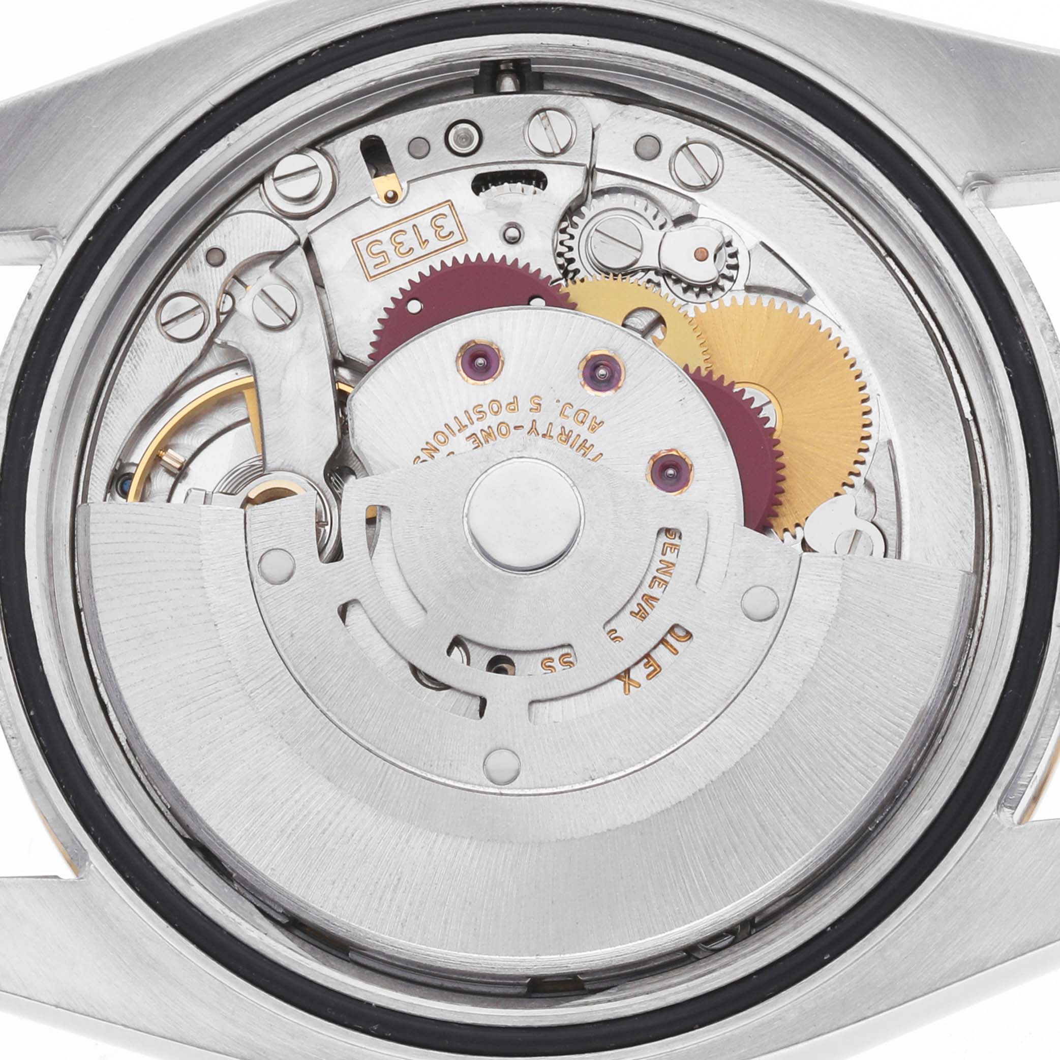The image shows the movement of a Rolex Datejust 116233 Men's Steel and Gold (two tone) White Dial watch from a rear angle, highlighting its gears and rotor mechanism.
