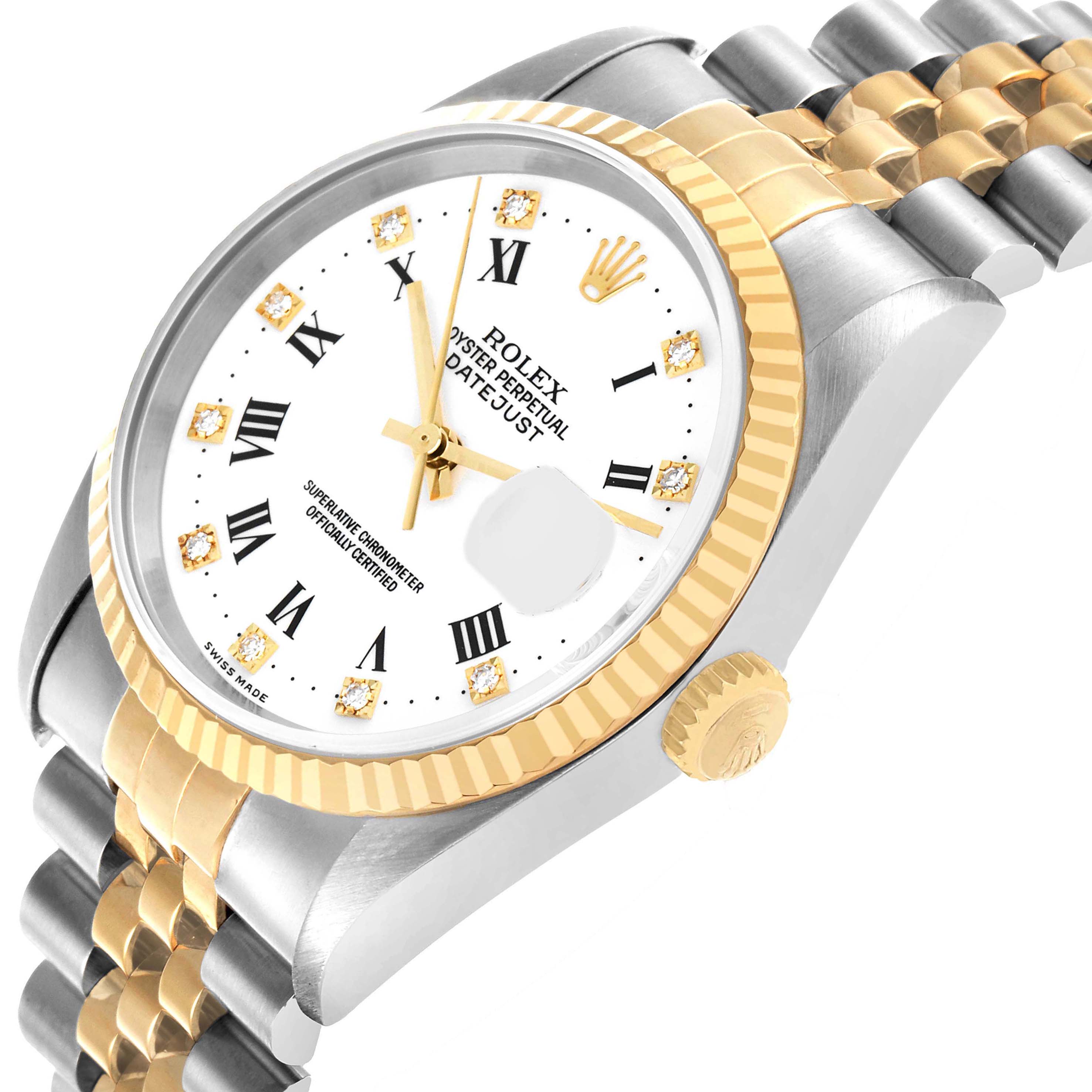 The Rolex Datejust 16233 Men's Steel and Gold (two tone) White Dial watch is shown at a tilted angle, highlighting the dial, crown, bezel, and part of the bracelet.