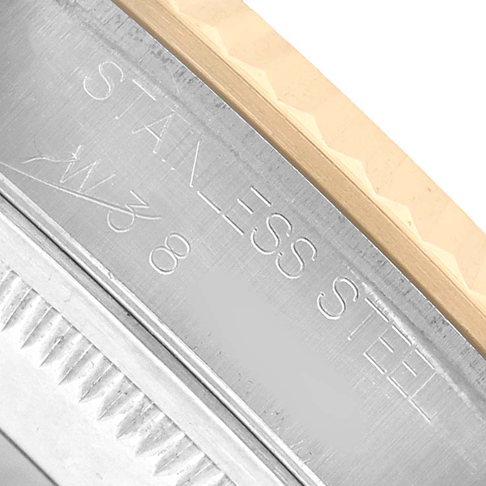 The image shows a close-up of a Rolex Datejust 16233 Men's Steel and Gold (two tone) White Dial's case, highlighting the stainless steel and outer edge of the bezel.