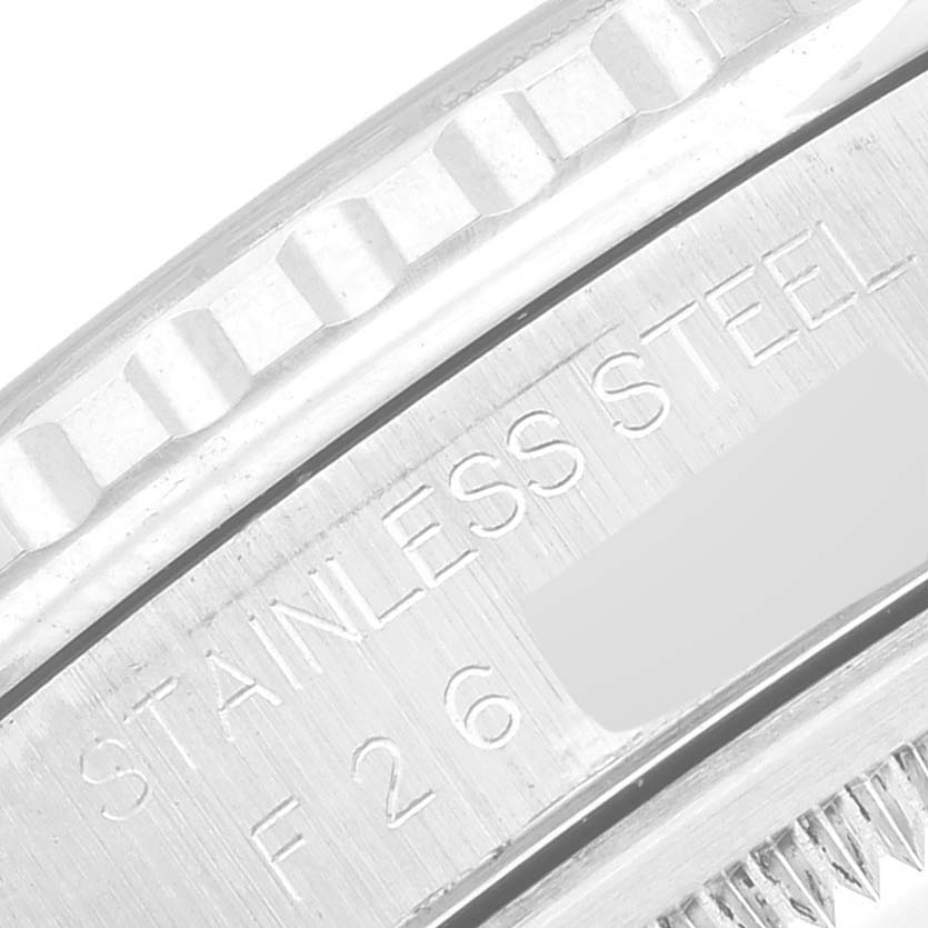 The image shows a close-up of the bezel and part of the casing of a Rolex Turn-o-Graph 16264 Men
s Stainless Steel Black Dial 16264 Men
s Stainless Steel Black Dial watch, highlighting the stainless steel inscription.