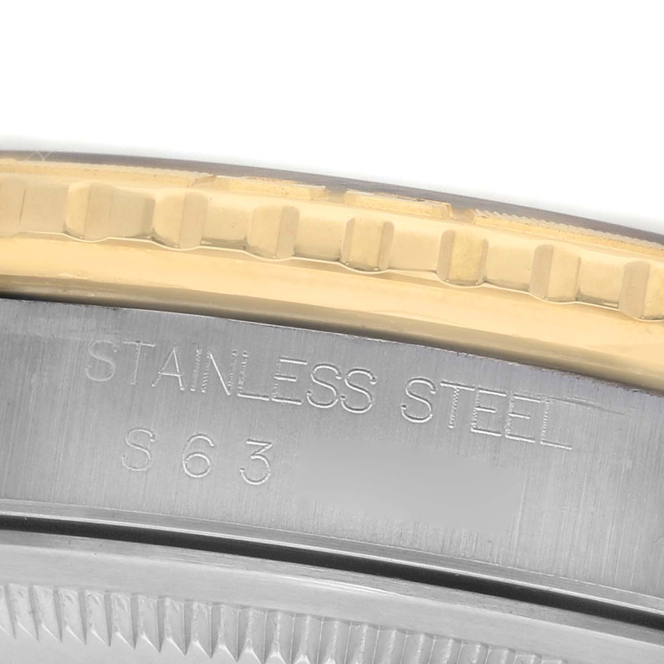 The image shows a close-up of the bezel and case back edge of the Rolex Turn-o-Graph 16263 Men's Steel and Gold (two tone) Champagne Dial, highlighting the stainless steel and gold details.