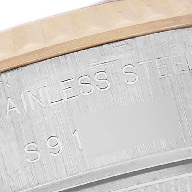 The image shows a close-up of the steel and gold bezel engraving on a Rolex Datejust 69173 Women's Steel and Gold (two tone) White Dial 69173 Women's Steel and Gold (two tone) White Dial watch.