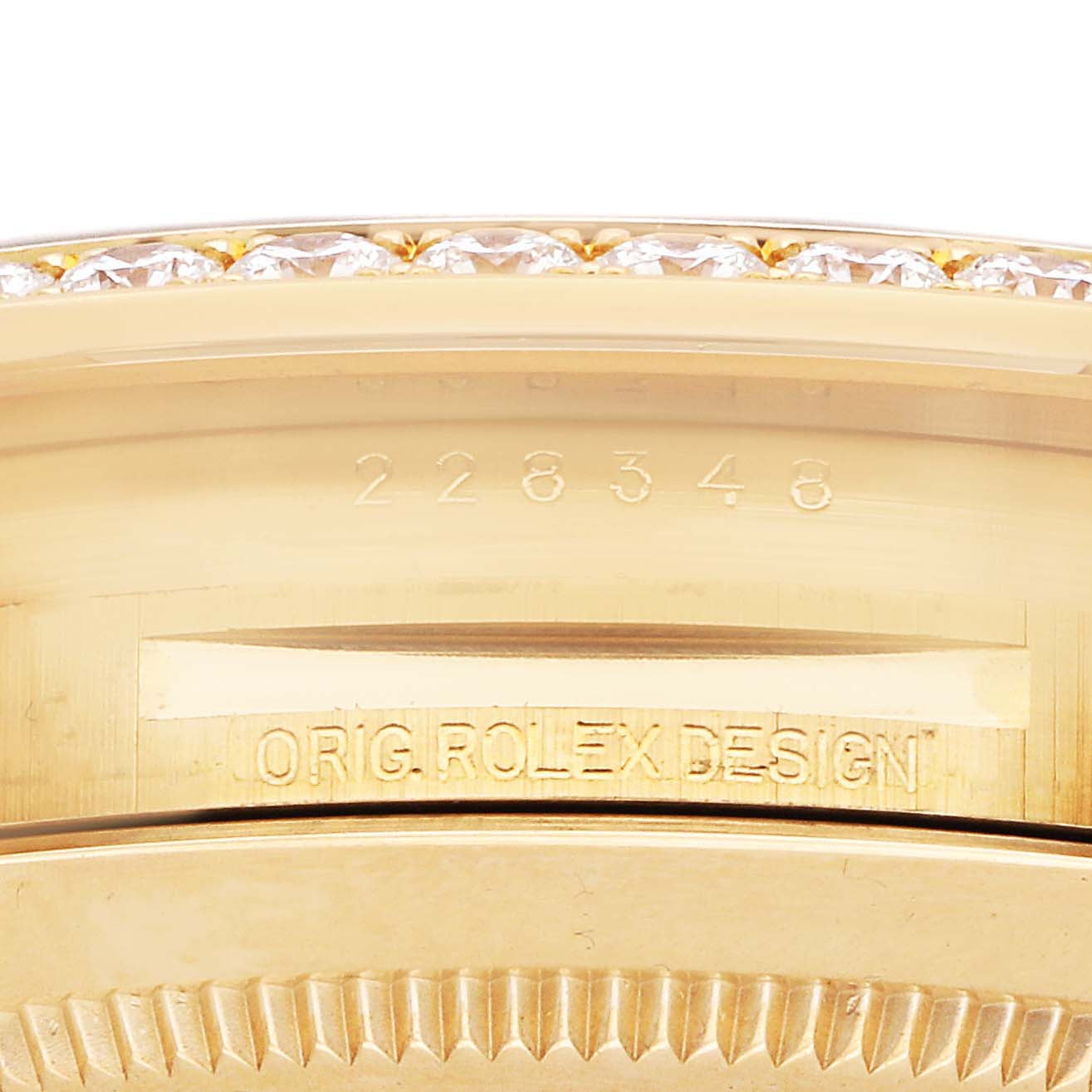 The image shows the engraved side of the Rolex President 228348 Men's Yellow Gold Black Dial watch case with the model number and "Orig. Rolex Design."
