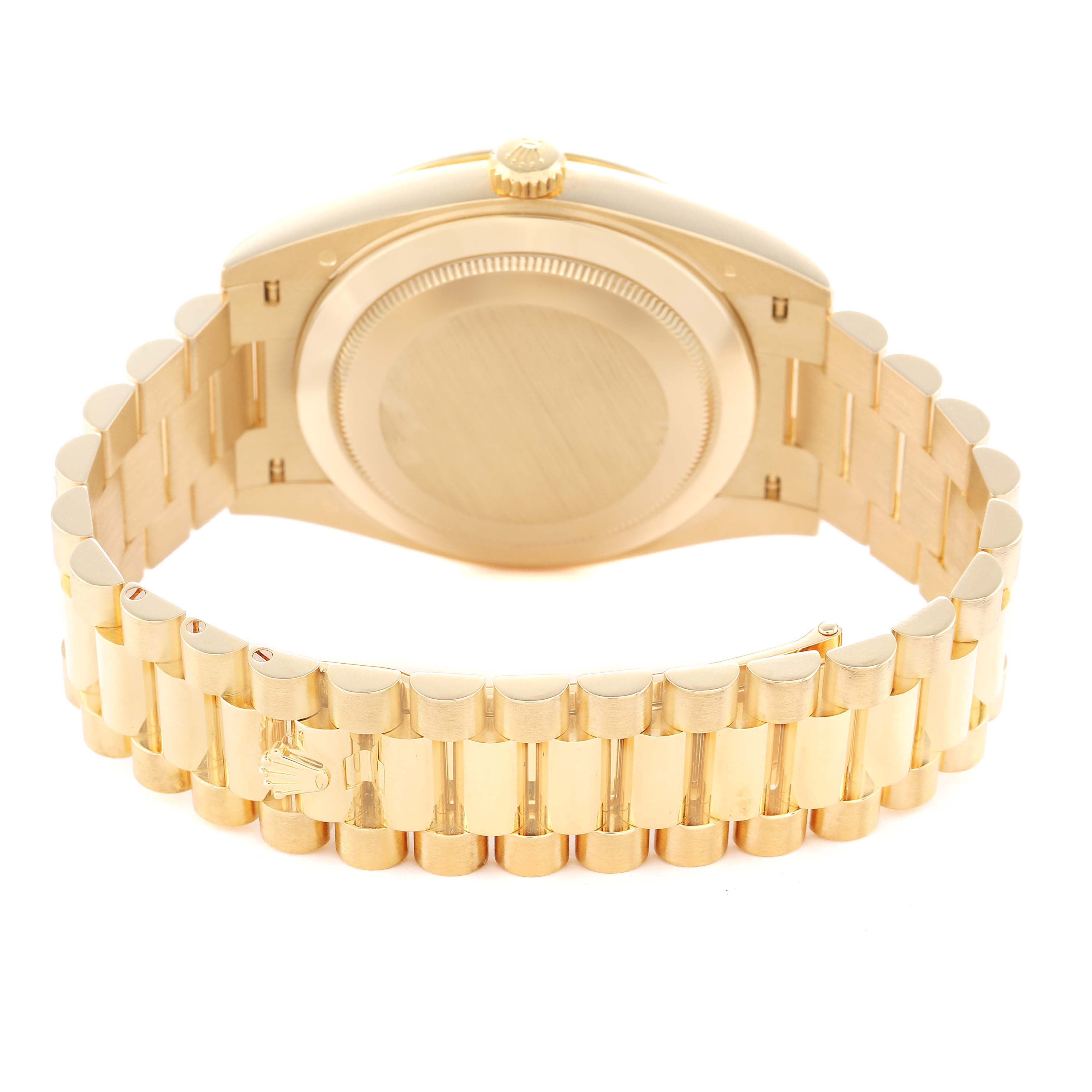 The image shows the rear view of a Rolex President 228348 Men's Yellow Gold Black Dial model, focusing on the case back and gold bracelet links.