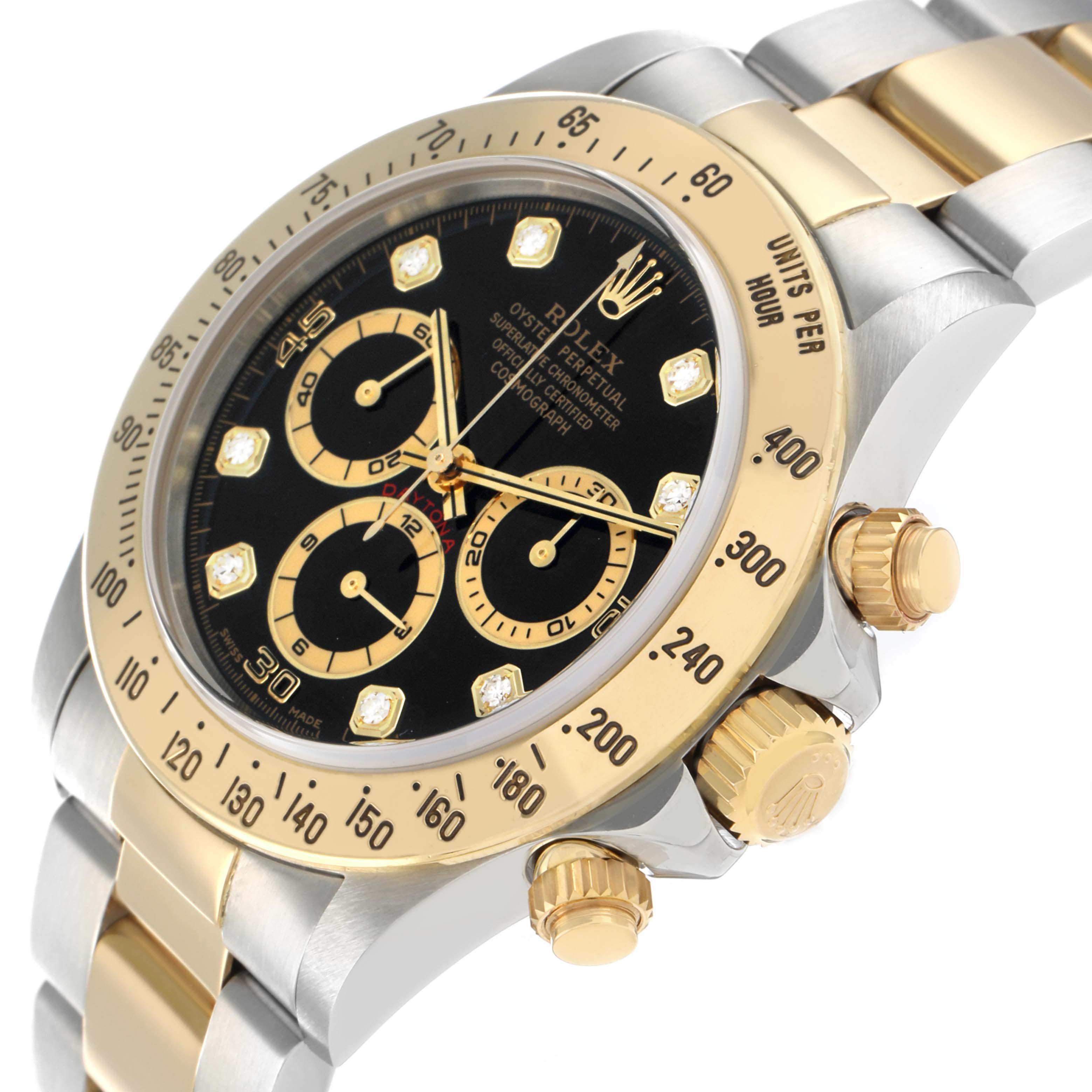 The Rolex Daytona 16523 Men's Steel and Gold (two tone) Black Dial watch is shown at an angle highlighting the bezel, crown, and part of the bracelet.