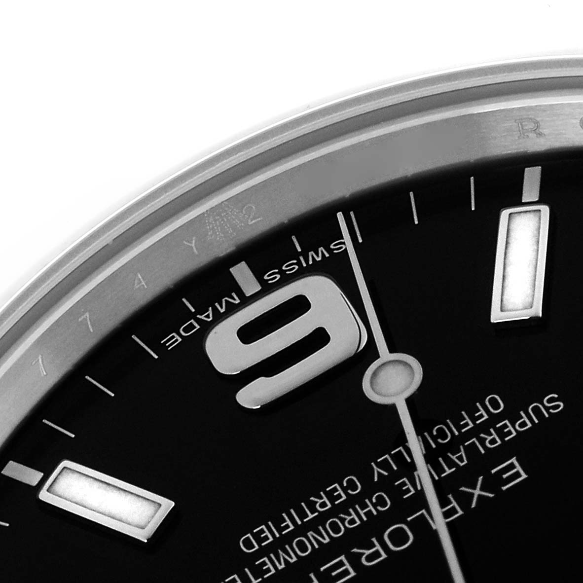 The image shows a close-up of the Rolex Explorer 214270 Men
s Stainless Steel Black Dial 214270 Men
s Stainless Steel Black Dial watch face, featuring part of the dial, numerals, and bezel.