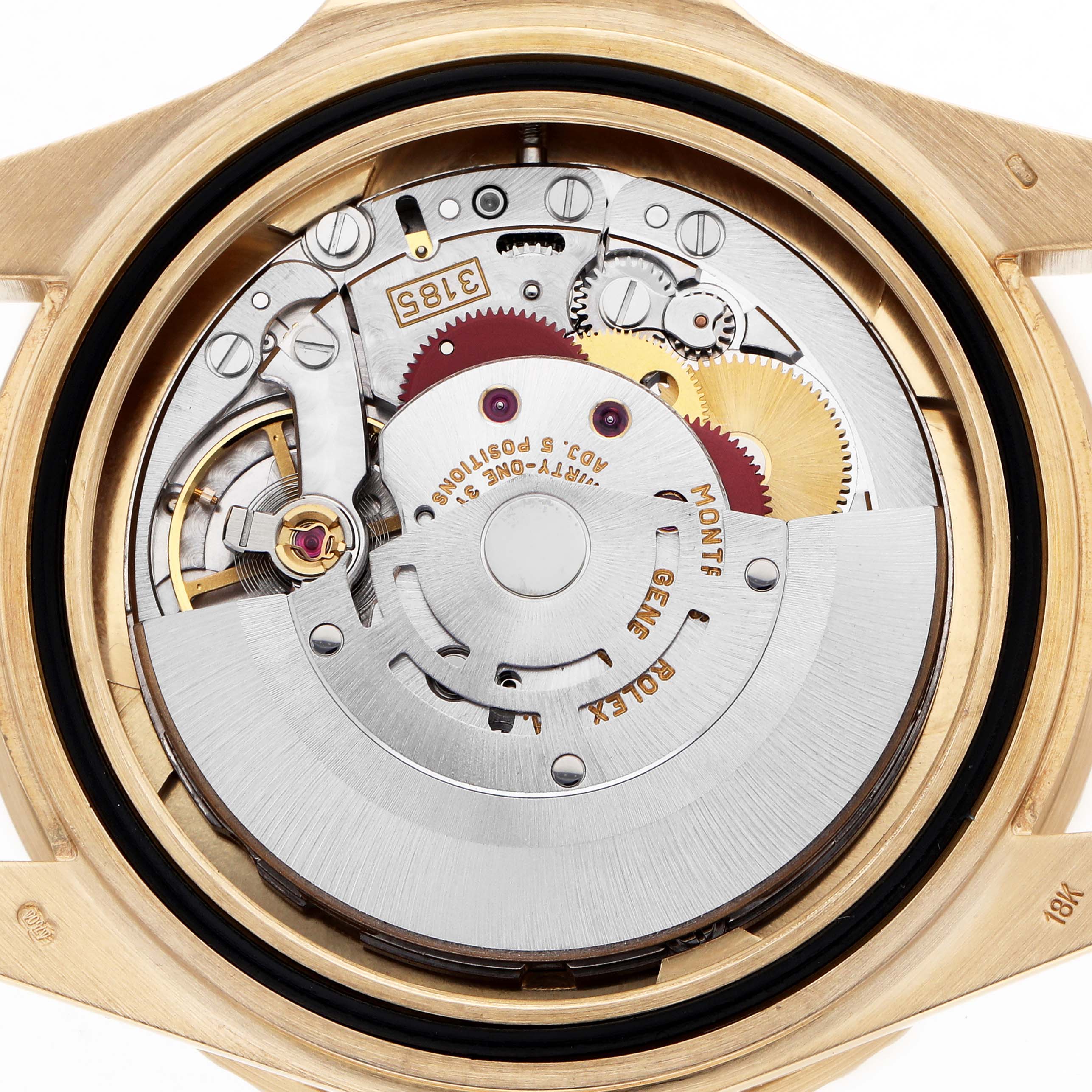 The image shows the back view of a Rolex GMT-Master 16718 Men's Yellow Gold Brown Dial, highlighting its intricate movement and internal components.