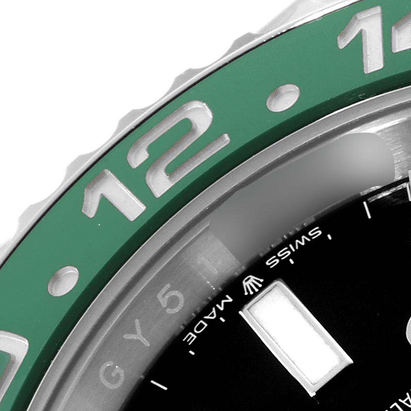 The image showcases a close-up of the bezel and part of the dial of a Rolex GMT-Master 126720VTNR-0001 Men
s Stainless Steel Black Dial 126720VTNR-0001 Men
s Stainless Steel Black Dial watch.