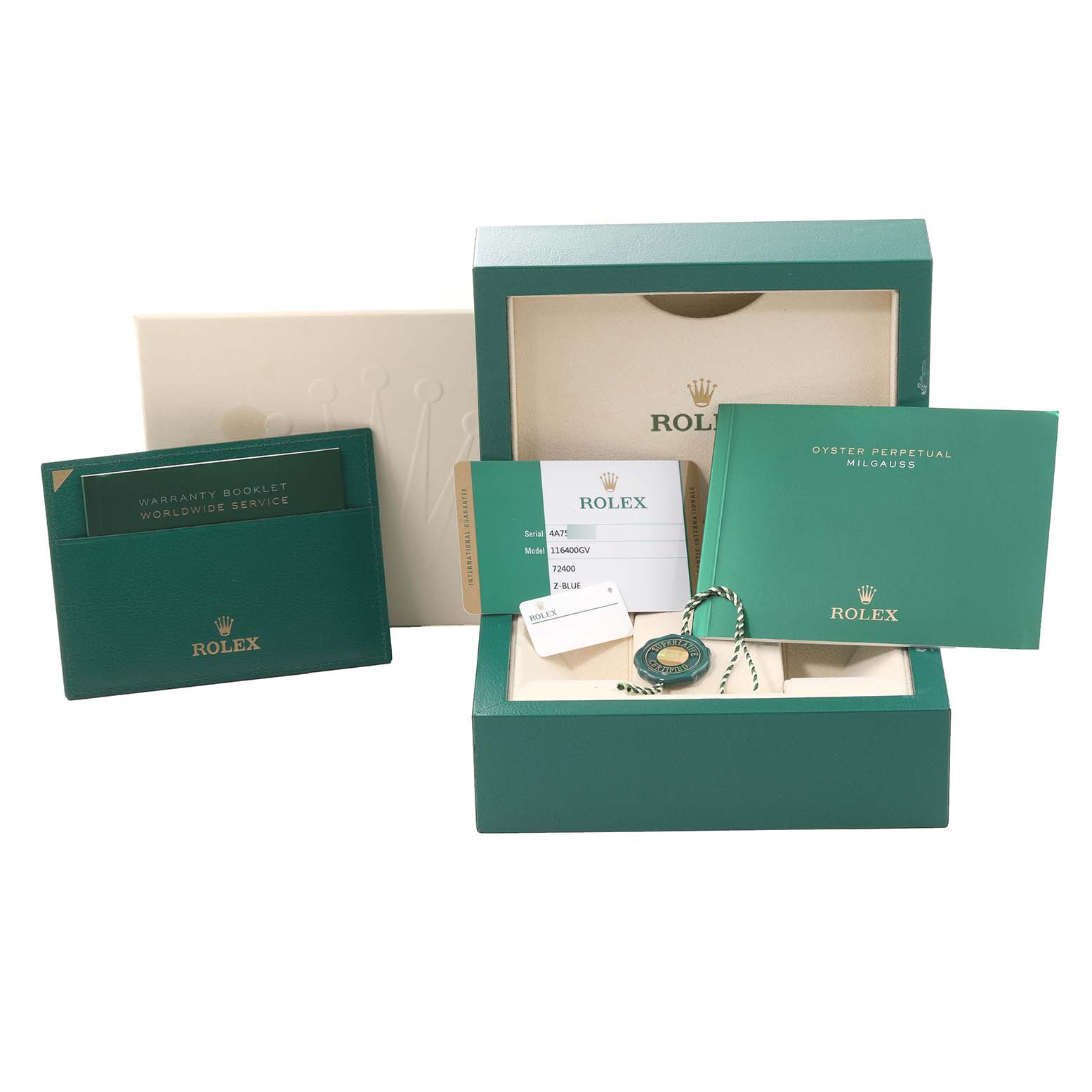 The image shows the packaging, warranty booklet, instruction manual, and tags for a Rolex Milgauss 116400GV Men's Stainless Steel Blue Dial 116400GV Men's Stainless Steel Blue Dial watch.
