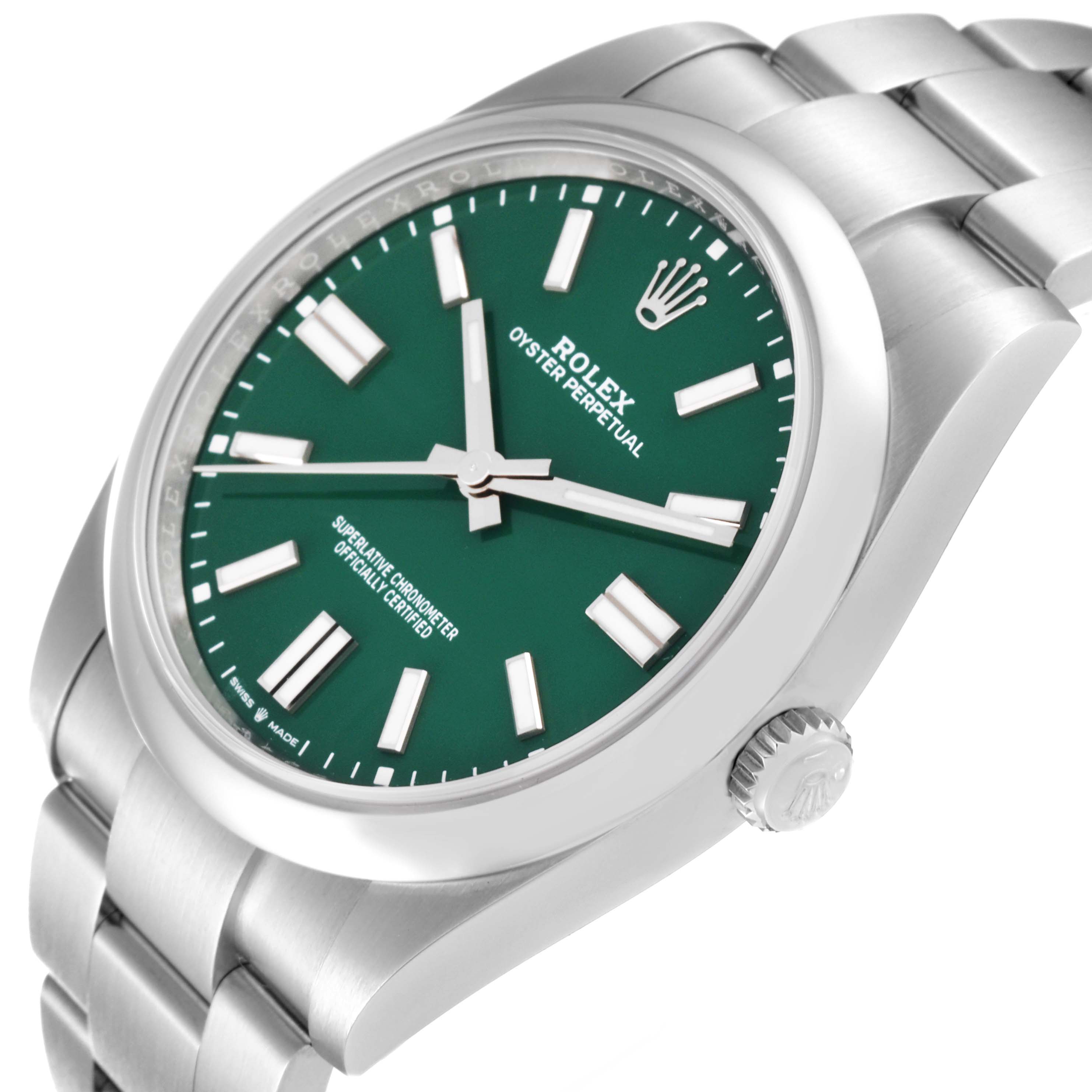 The image shows a Rolex Oyster Perpetual 124300 Men
s Stainless Steel Green Dial 124300 Men
s Stainless Steel Green Dial watch at an oblique angle, displaying the face, crown, and part of the bracelet.