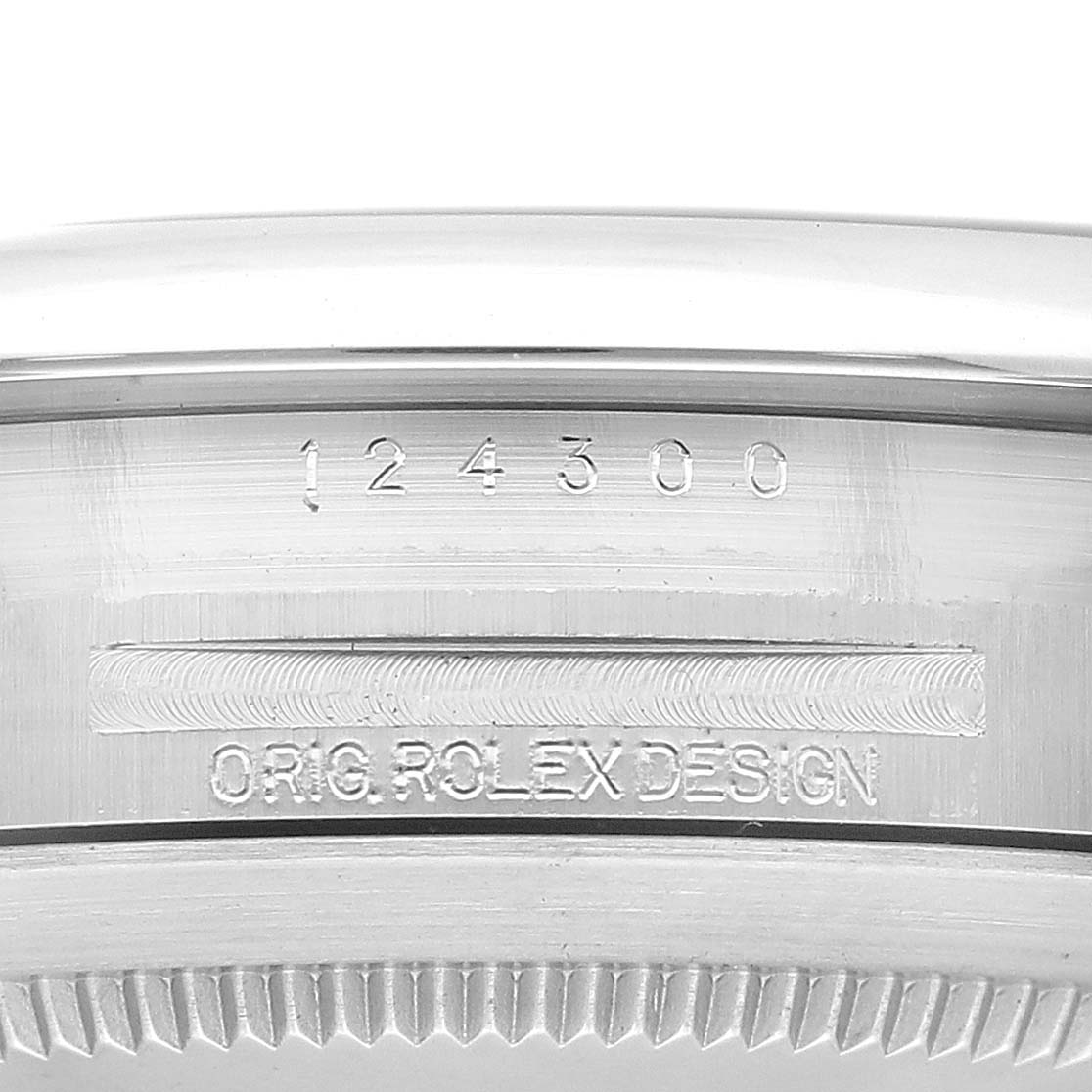 This close-up image shows the side profile of the Oyster Perpetual Rolex watch, highlighting the engraved model number and "ORIG. ROLEX DESIGN."