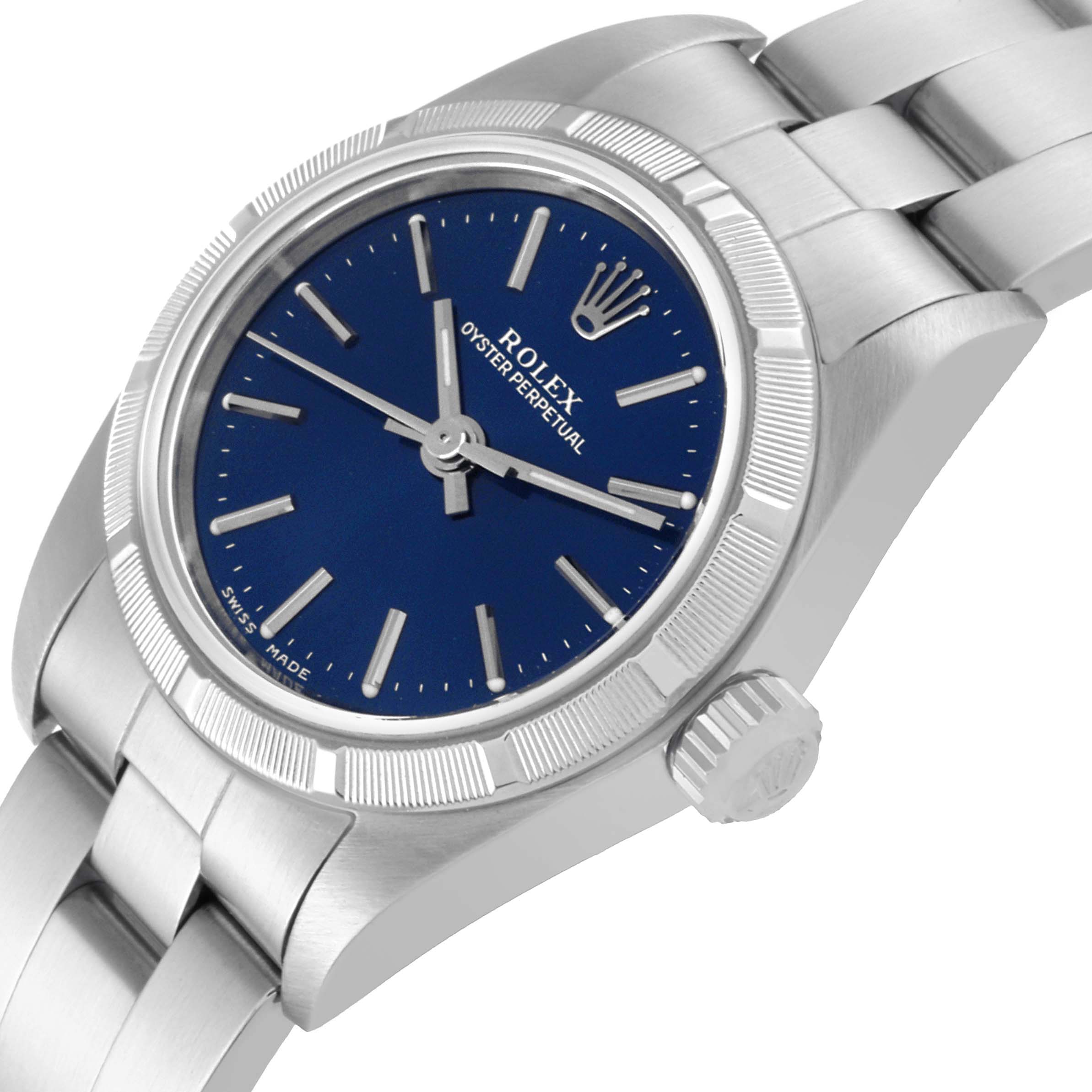 The image shows a Rolex Oyster Perpetual 76030 Women's Stainless Steel Blue Dial 76030 Women's Stainless Steel Blue Dial watch from a partly top-right angle, highlighting the dial, bezel, bracelet, and crown.