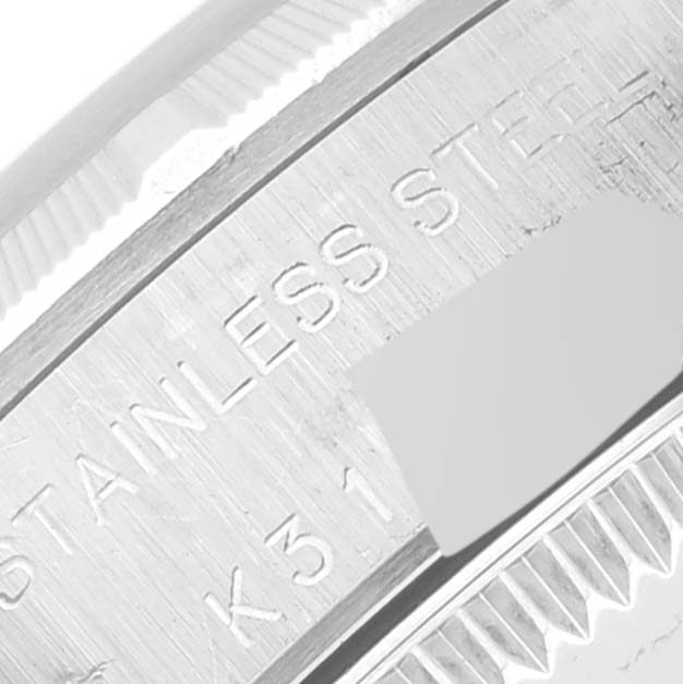 This image shows a close-up of the case side of the Rolex Oyster Perpetual 76030 Women's Stainless Steel Blue Dial 76030 Women's Stainless Steel Blue Dial watch, highlighting its stainless steel engraving.