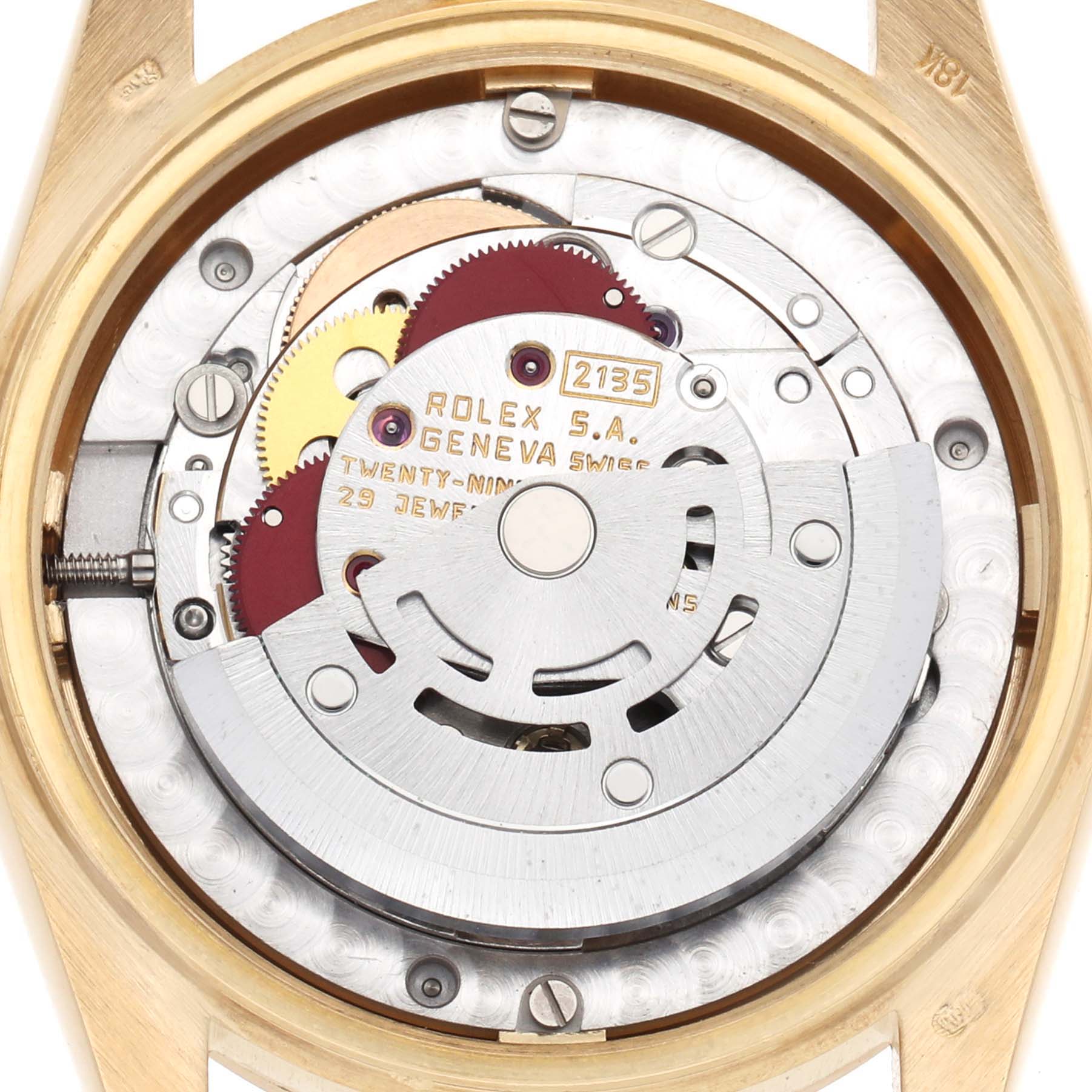 The image shows the movement mechanism of a Rolex President 68278 Women's Yellow Gold Silver Dial watch, focusing on the intricate gears and rotor from the back.