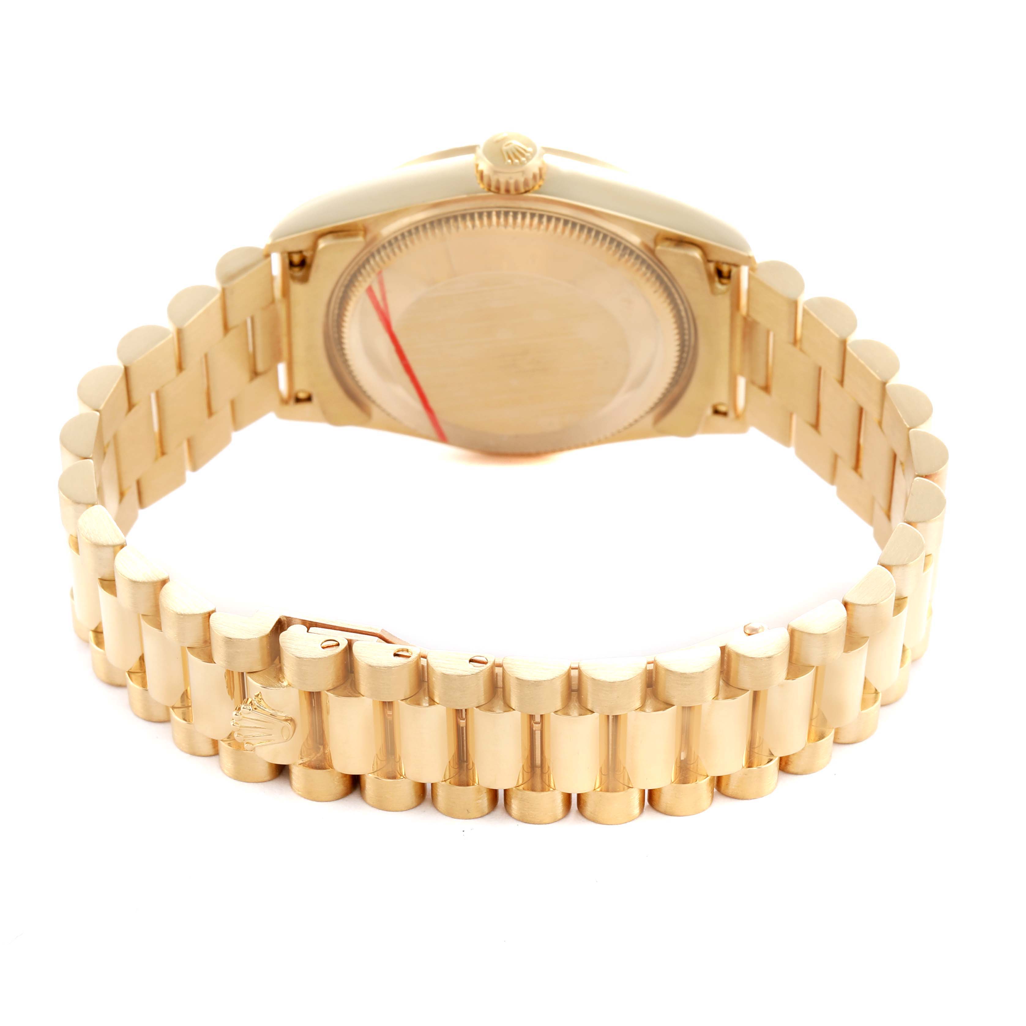 The image shows the Rolex President 68278 Women's Yellow Gold White Dial watch from the back, highlighting its case back, crown, and distinctive bracelet.