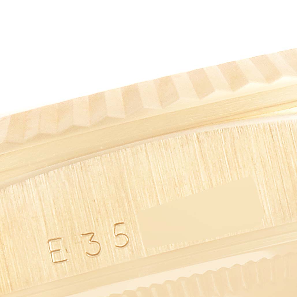 This is a close-up angle showing part of the bezel and case of a Rolex President 18238 Men's Yellow Gold Champagne Dial 18238 Men's Yellow Gold Champagne Dial model watch.