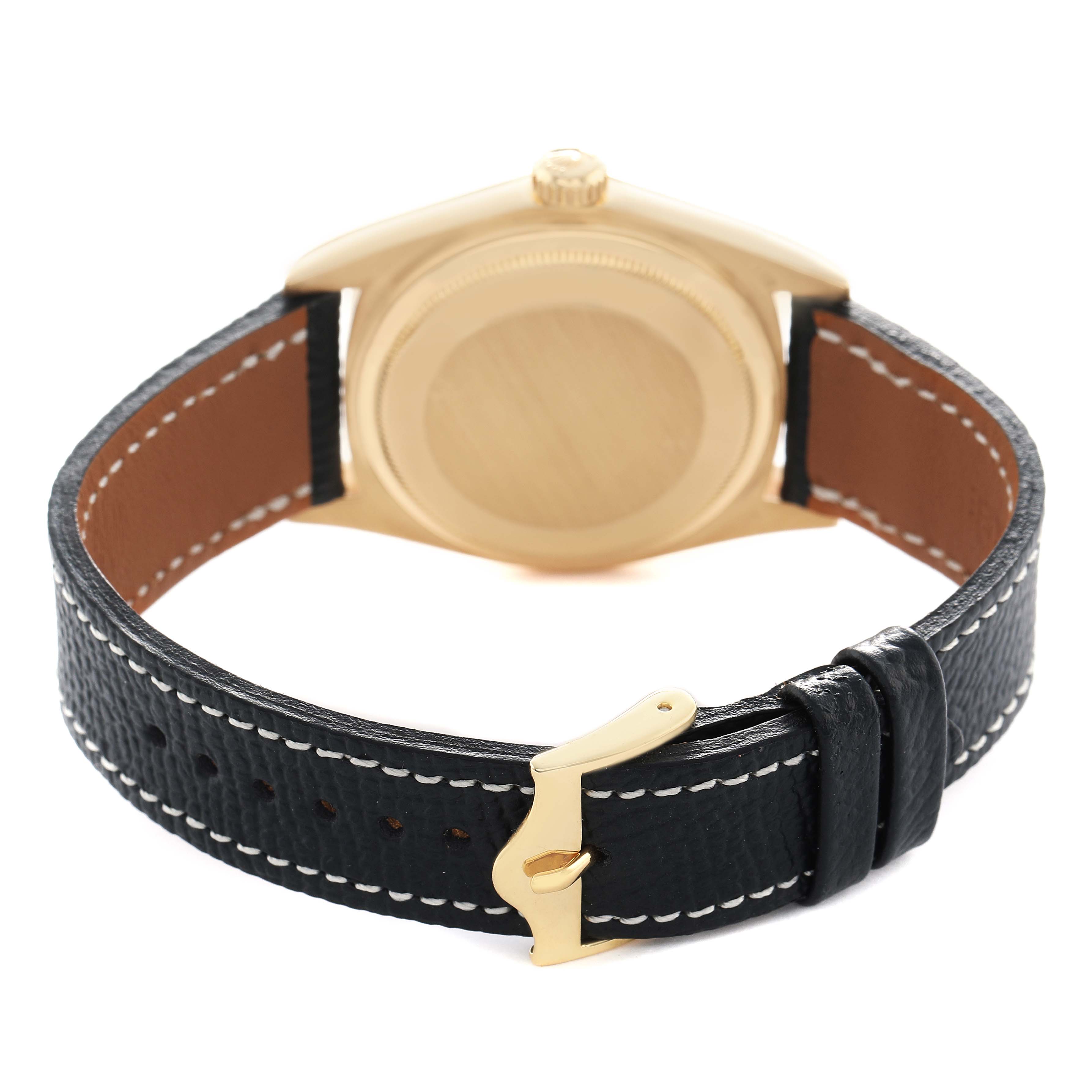 The image shows the back of a Rolex President 18038 Men's Yellow Gold Champagne Dial watch, highlighting the case back and leather strap with a gold clasp.