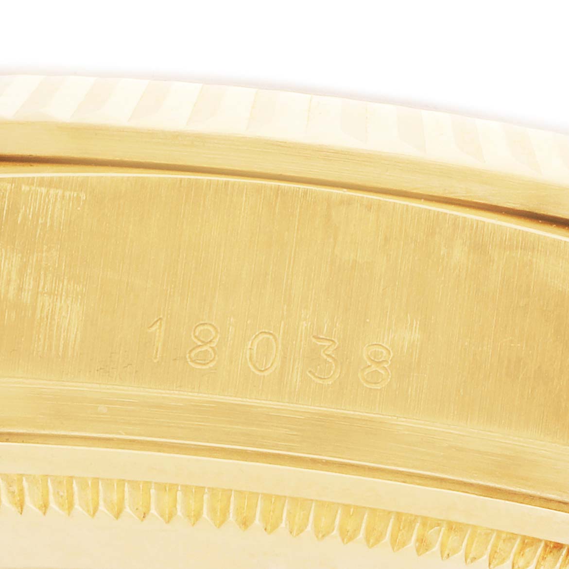 This image shows a close-up of the side of a Rolex President 18038 Men's Yellow Gold Champagne Dial model, highlighting the model number engraving.