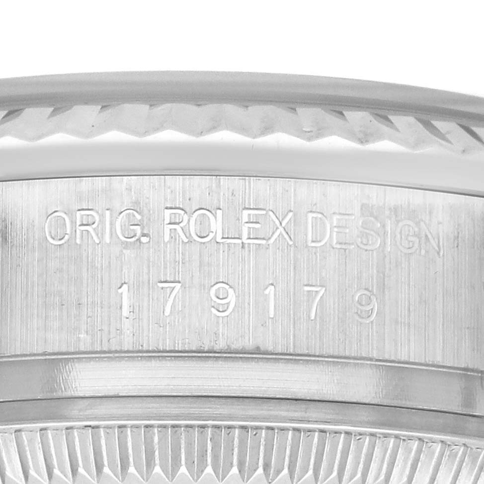 This close-up shows the engraved model number and design detail of the Rolex President 179179 Women's White Gold Silver Dial 179179 Women's White Gold Silver Dial watch, focused on the edge.