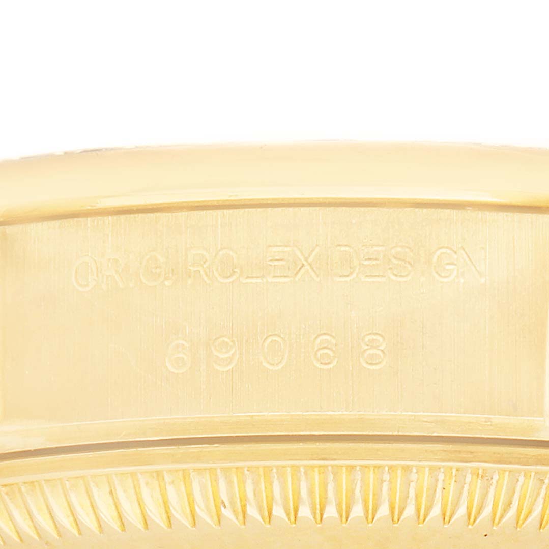 The image shows a close-up of the Rolex President 69068 Women's Yellow Gold Mother of Pearl Dial watch's side, focusing on the engraved model number.