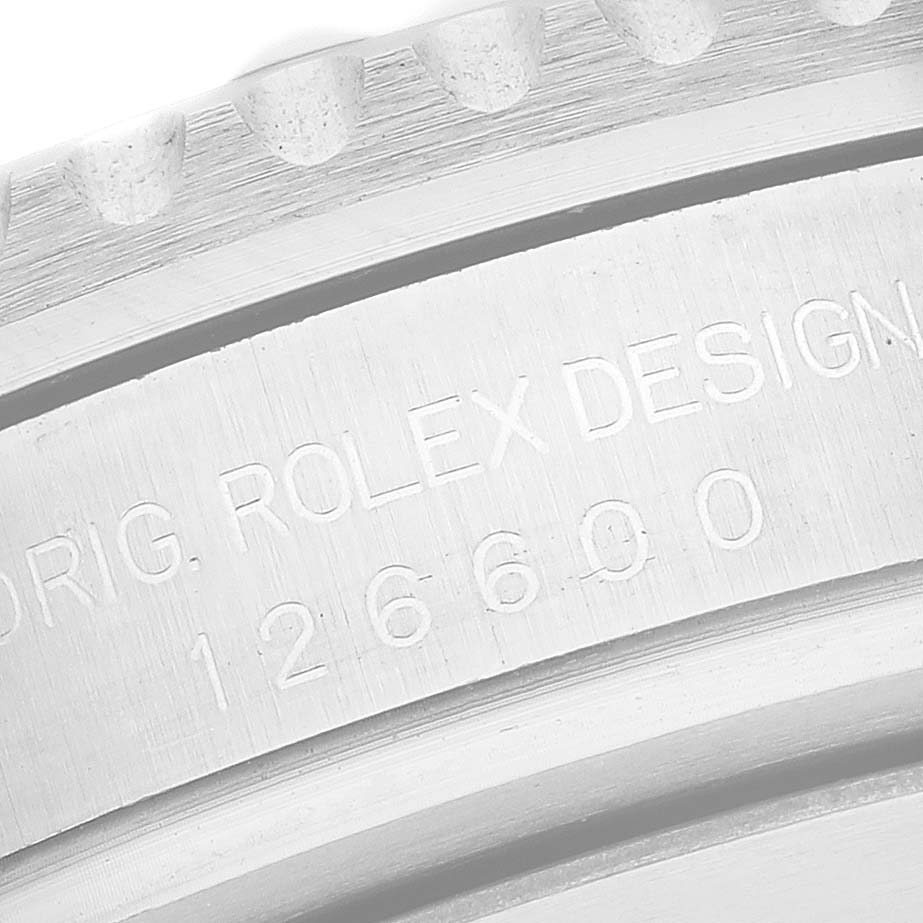 This image shows a close-up of the case back of a Rolex Sea-Dweller 126600 Men
s Stainless Steel Black Dial 126600 Men
s Stainless Steel Black Dial watch, focusing on the engraved model number and brand name.
